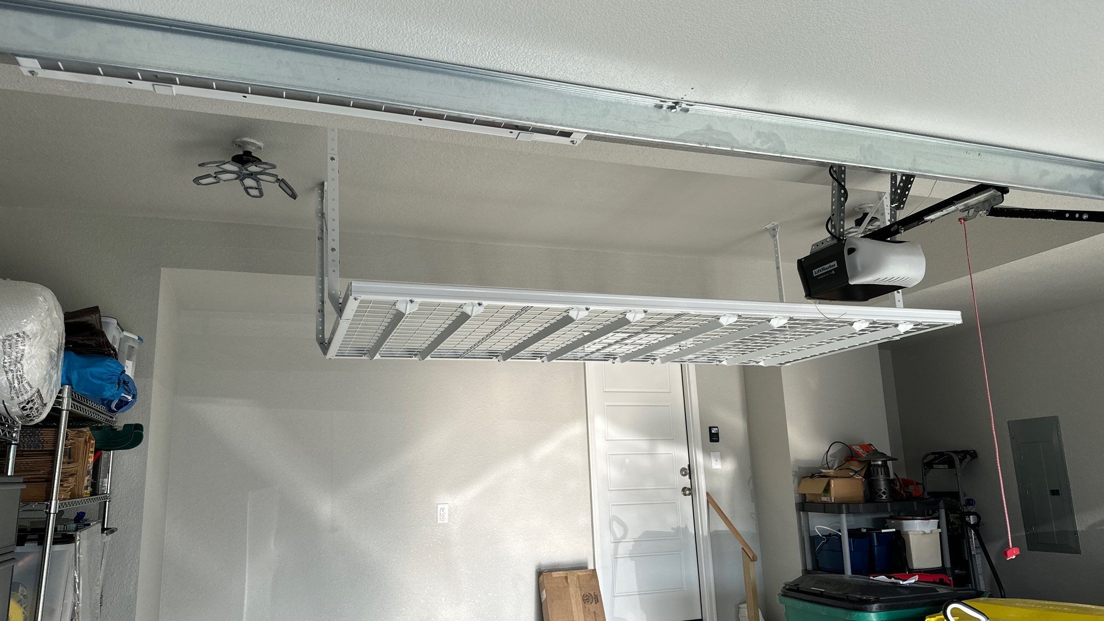 John H. maximized his storage with overhead racks and wall shelves by Banner Garage