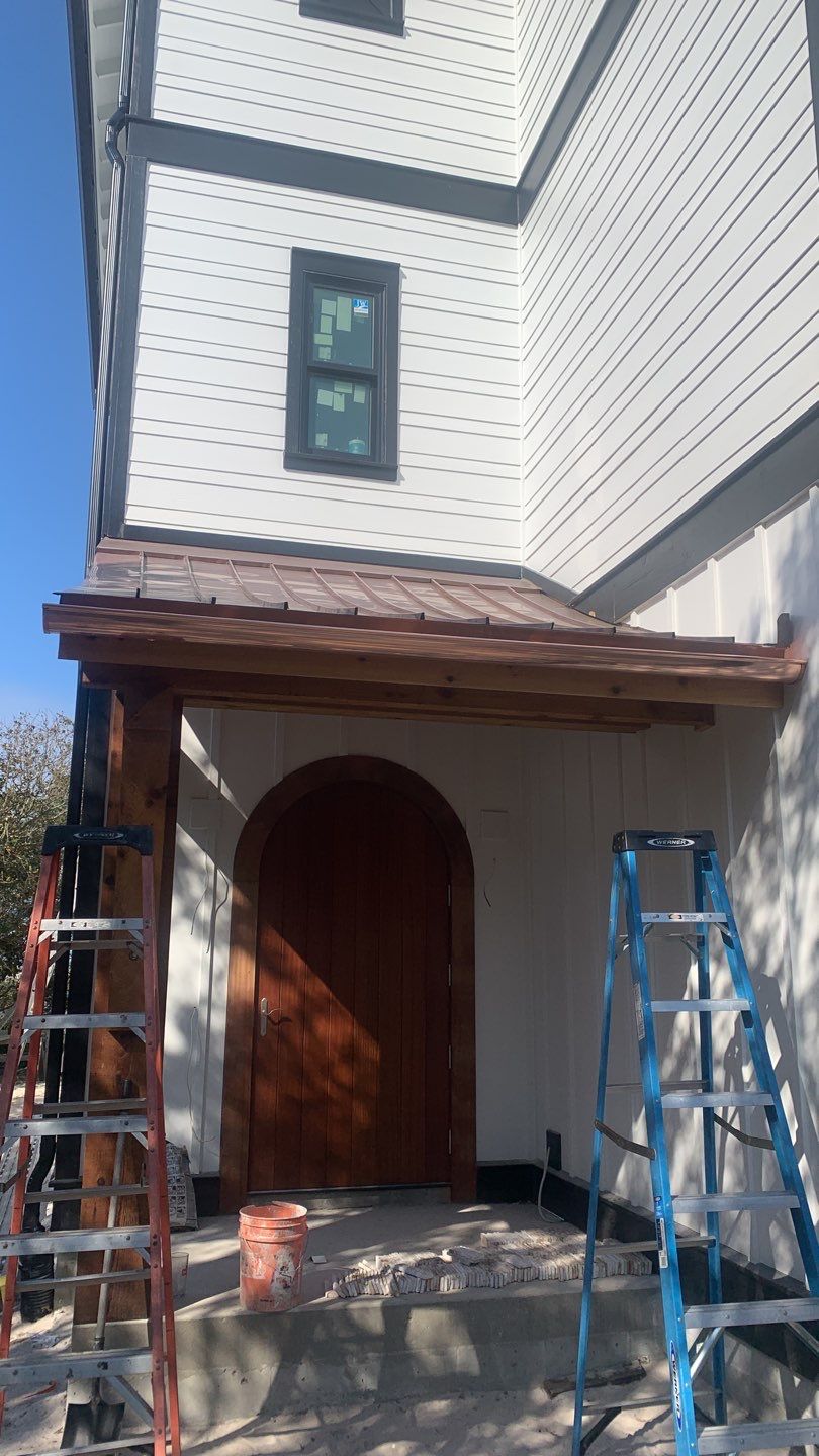 Seamless Gutter Installation Using Black Half Round Seamless Gutters by Gutter Professors