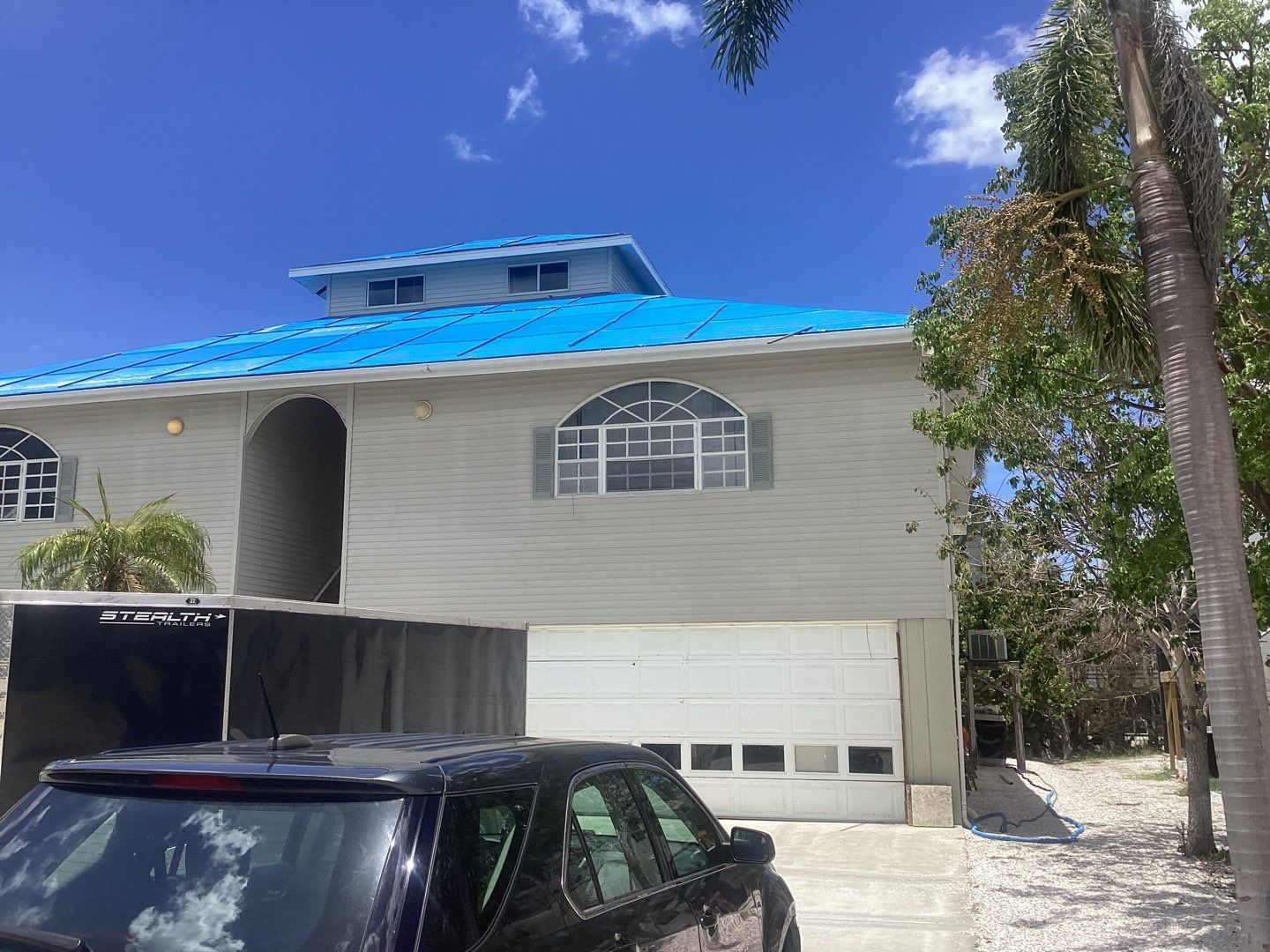 Complete Gutter System with Downspouts & Guards in Fort Myers Beach FL by Gutter Professors