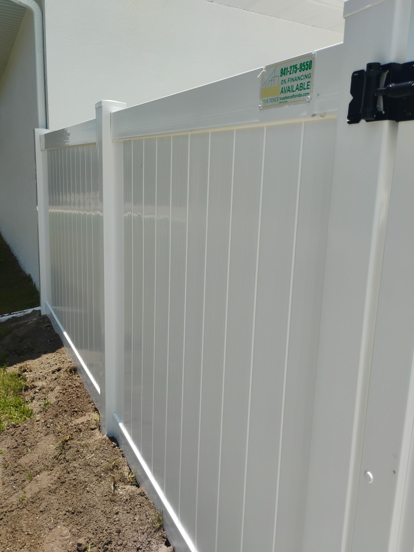 White Vinyl Privacy Fence Installation and Gate Repair in Port Charlotte by True Fence LLC