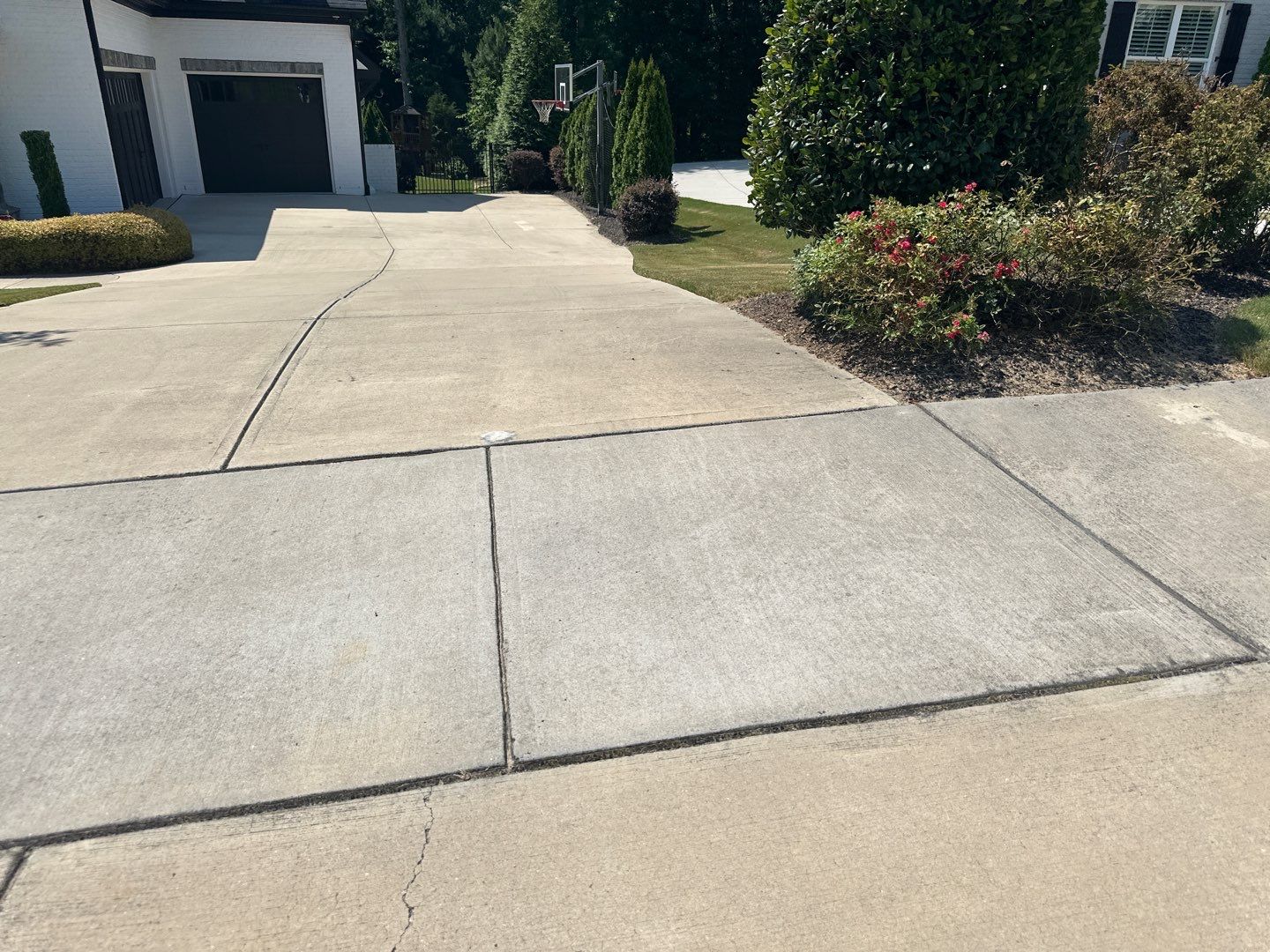 Concrete Driveway, Wood Playset using Wood Sealant and Concrete Sealant by DuraSeal