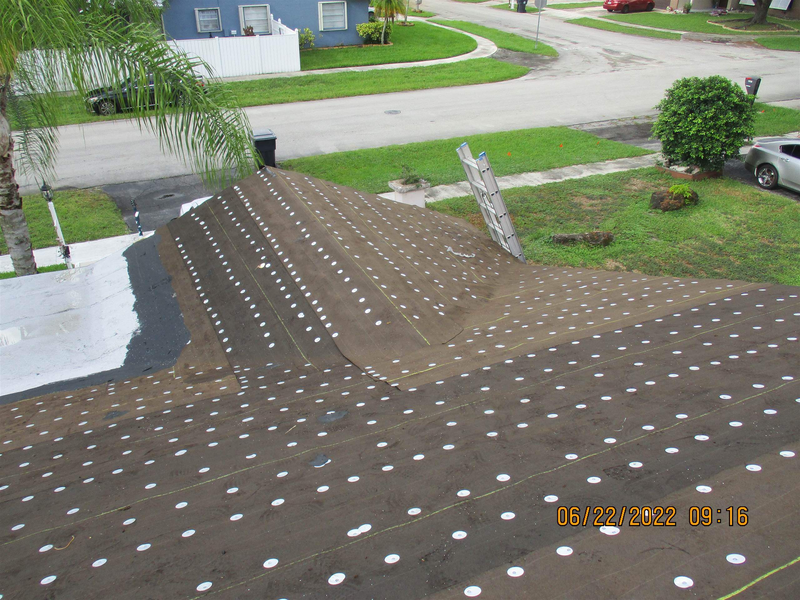 Residential Roofing Installation using 1.5" Nail Strip 24ga Solar White Kynar Coated Standing Seam Metal Panels by Morton Roofing, Inc.