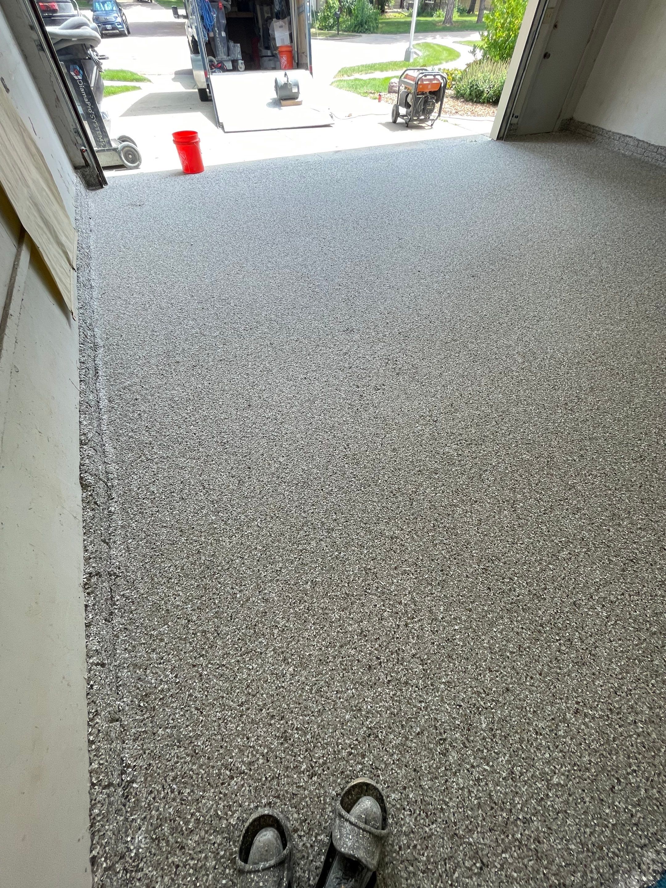 Custom Creekbed Garage Floor Coating in Sioux Falls by Select Painting, Coatings & Garage Cabinets