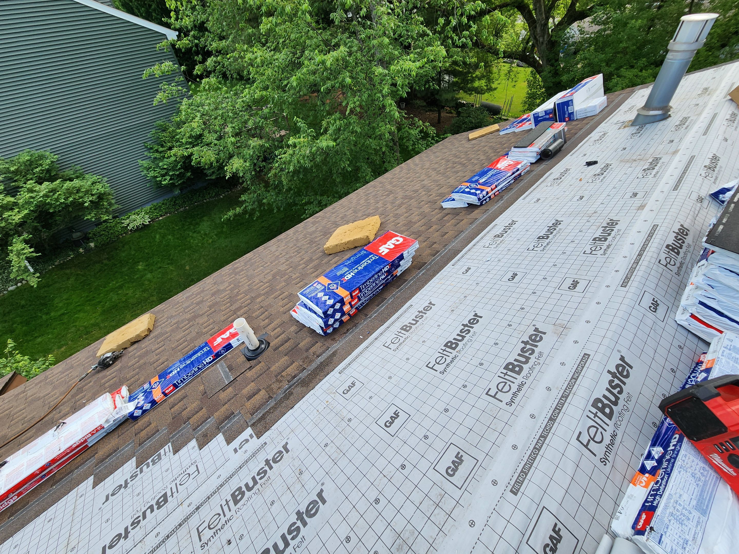 Installing new Roof and Gutter Protection after Hail Damage by Acme Exteriors