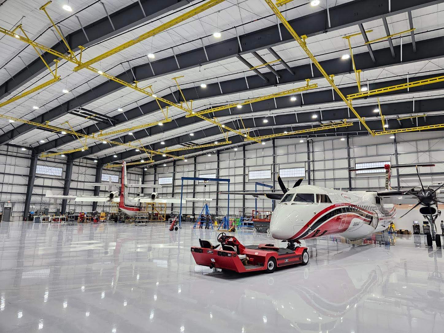 Airplane Hanger using Light Grey Commercial Penntek Epoxy by Croc Coatings, LLC