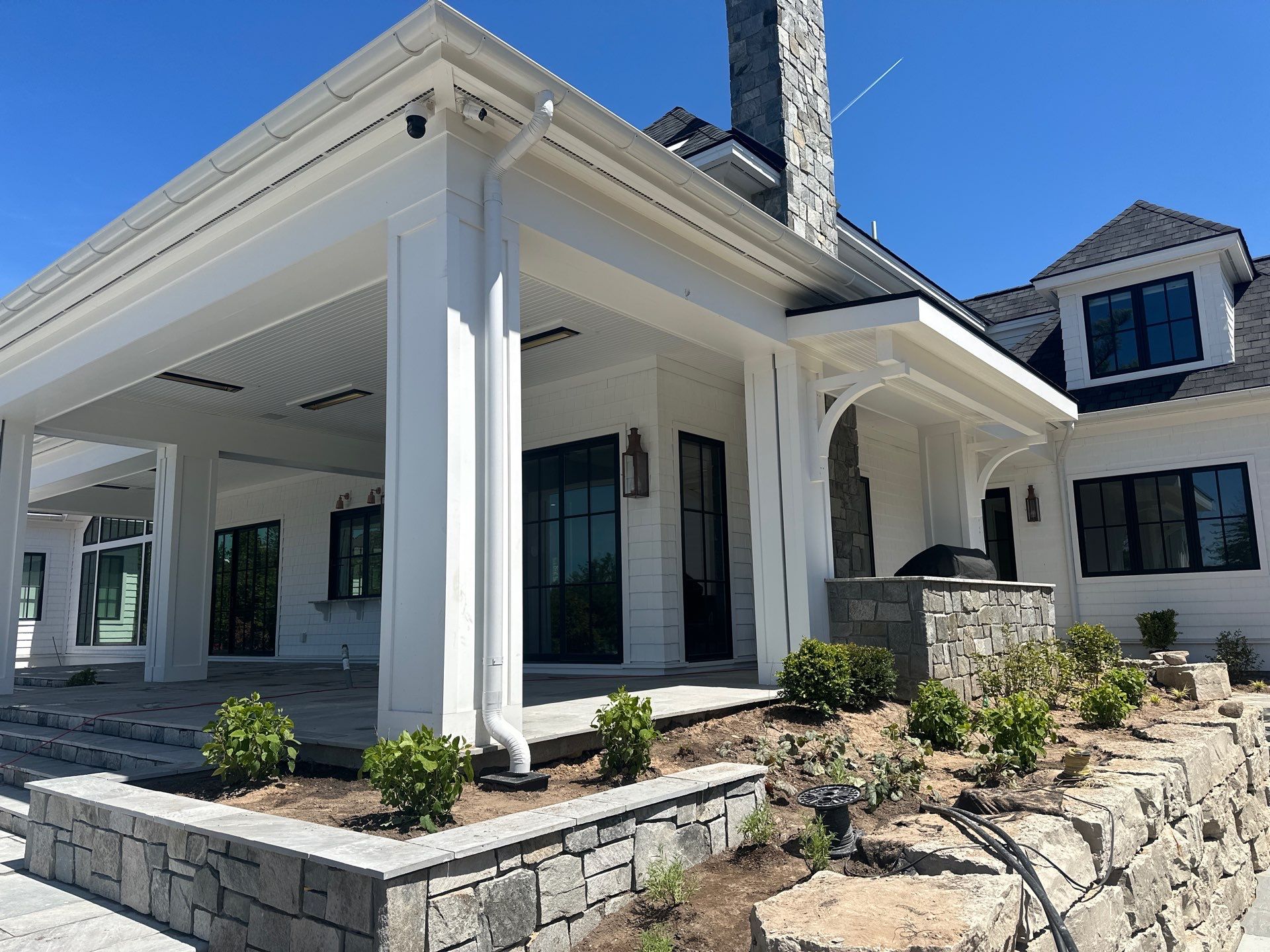 Gutter System and Exterior Drainage Installation in Charlevoix by Rainbow Seamless Systems