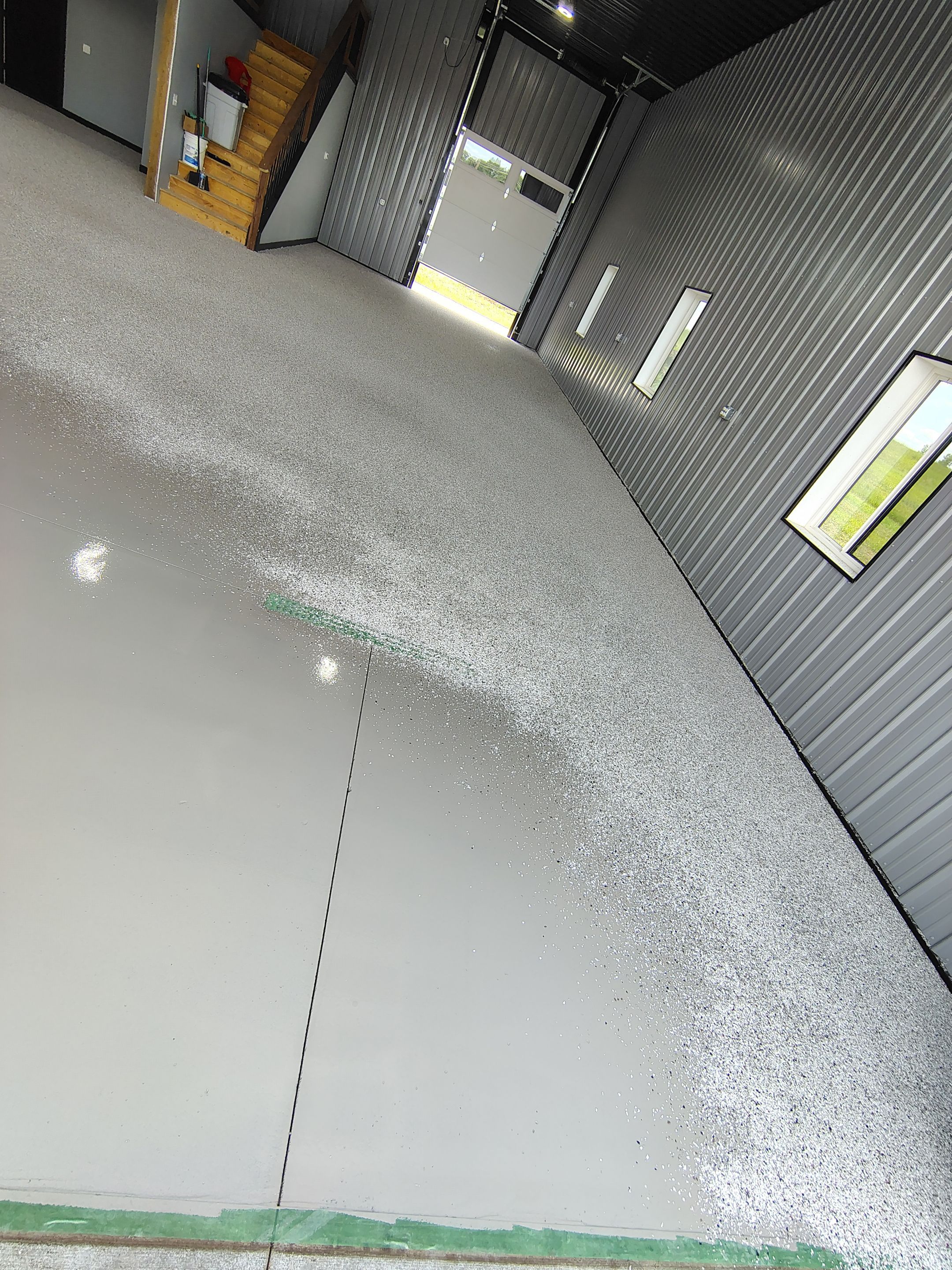 Polyaspartic Garage Floor Coating with Decorative Flake in Wentworth by Select Painting, Coatings & Garage Cabinets