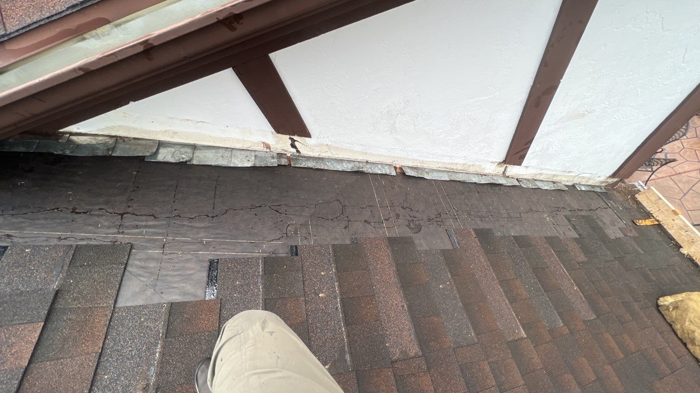Step flashing repair on roof to wall by Pro Home Services Inc