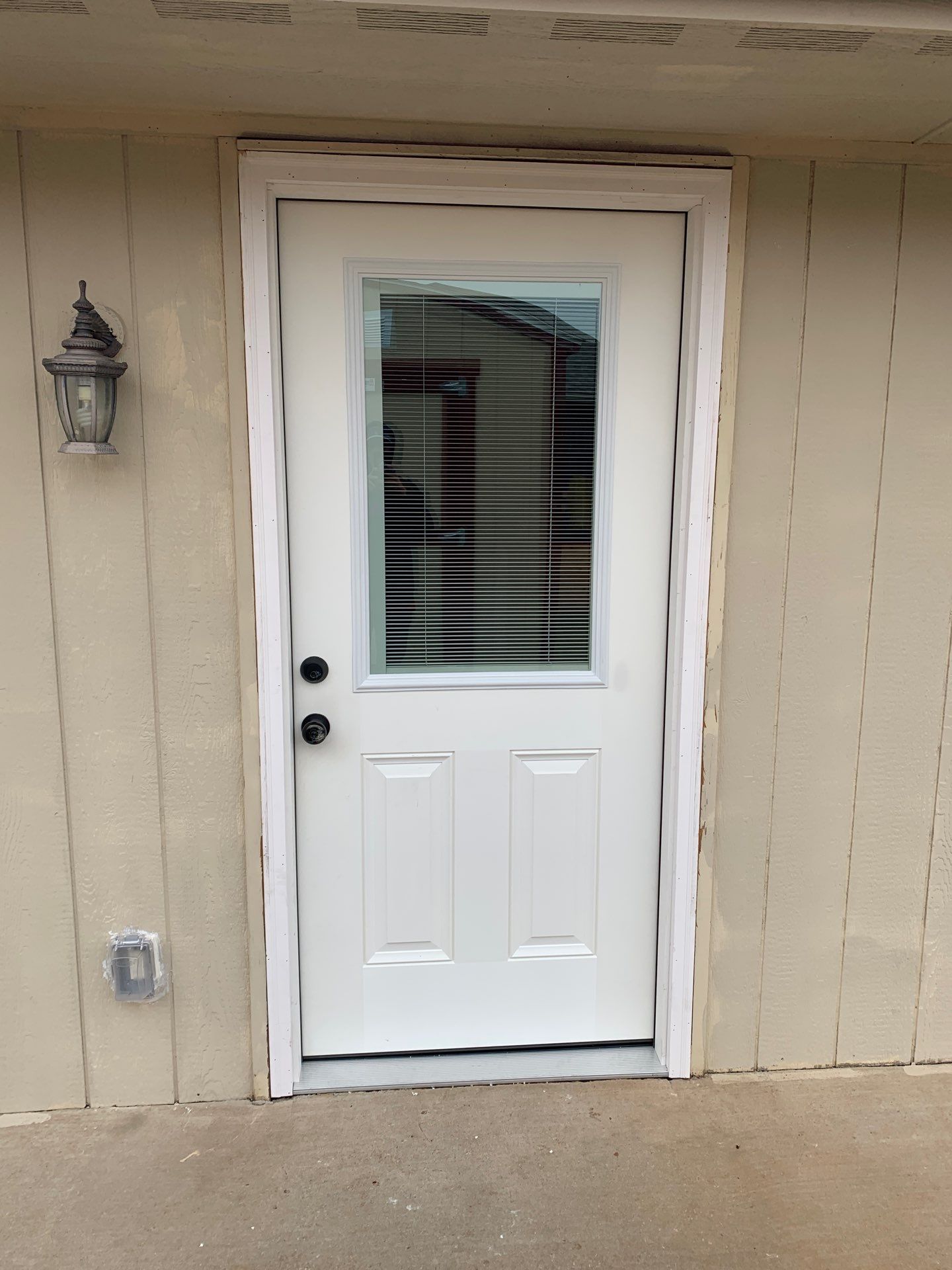 door replacement in Yukon by McCann's Roofing and Construction