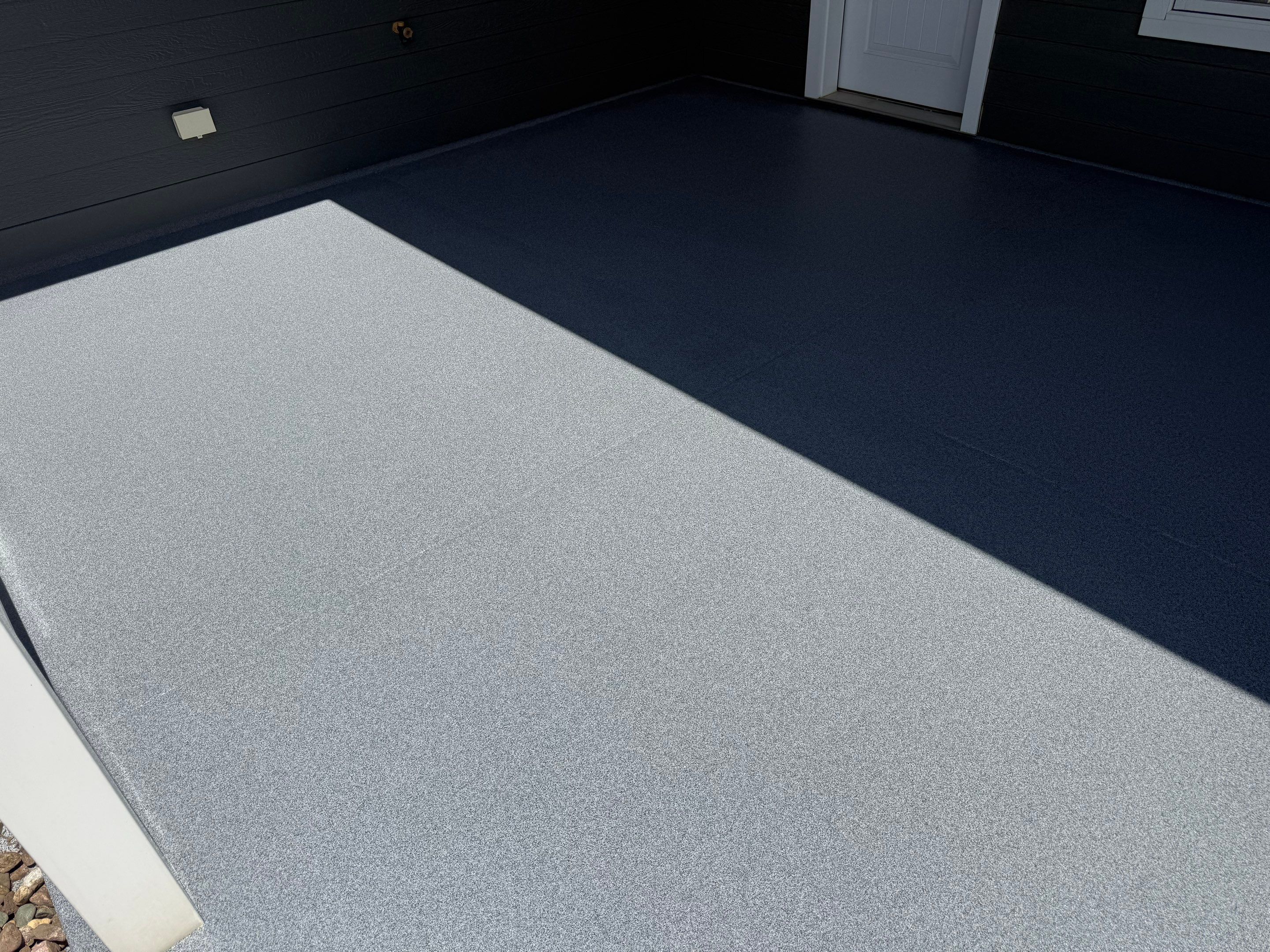 Polyurea Patio Floor Coating in Starry Evening for Sioux Falls Home by Select Painting, Coatings & Garage Cabinets