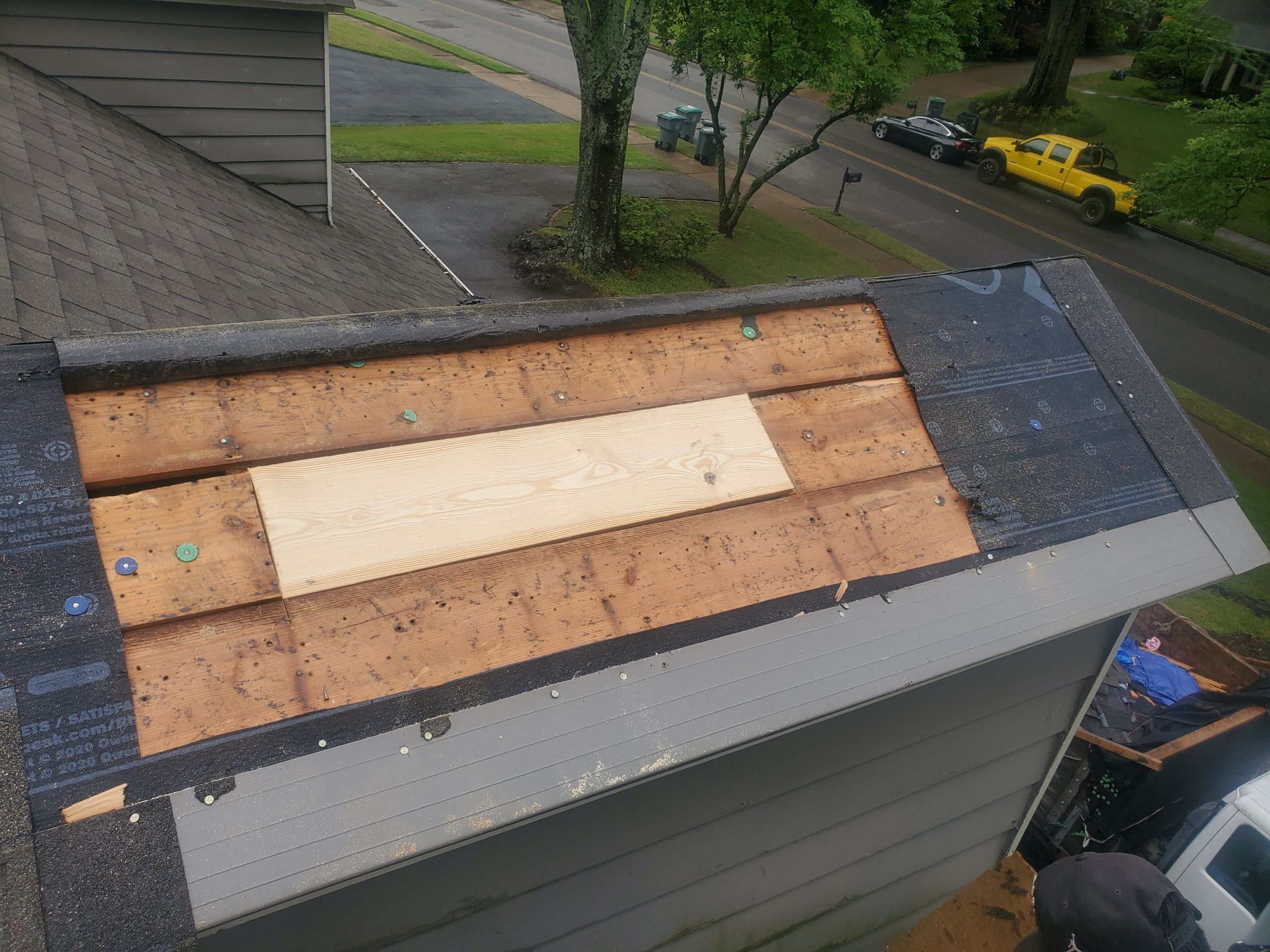Residential Roof Repair and Decking Replacement After Tree Damage by Revival Roofing Services