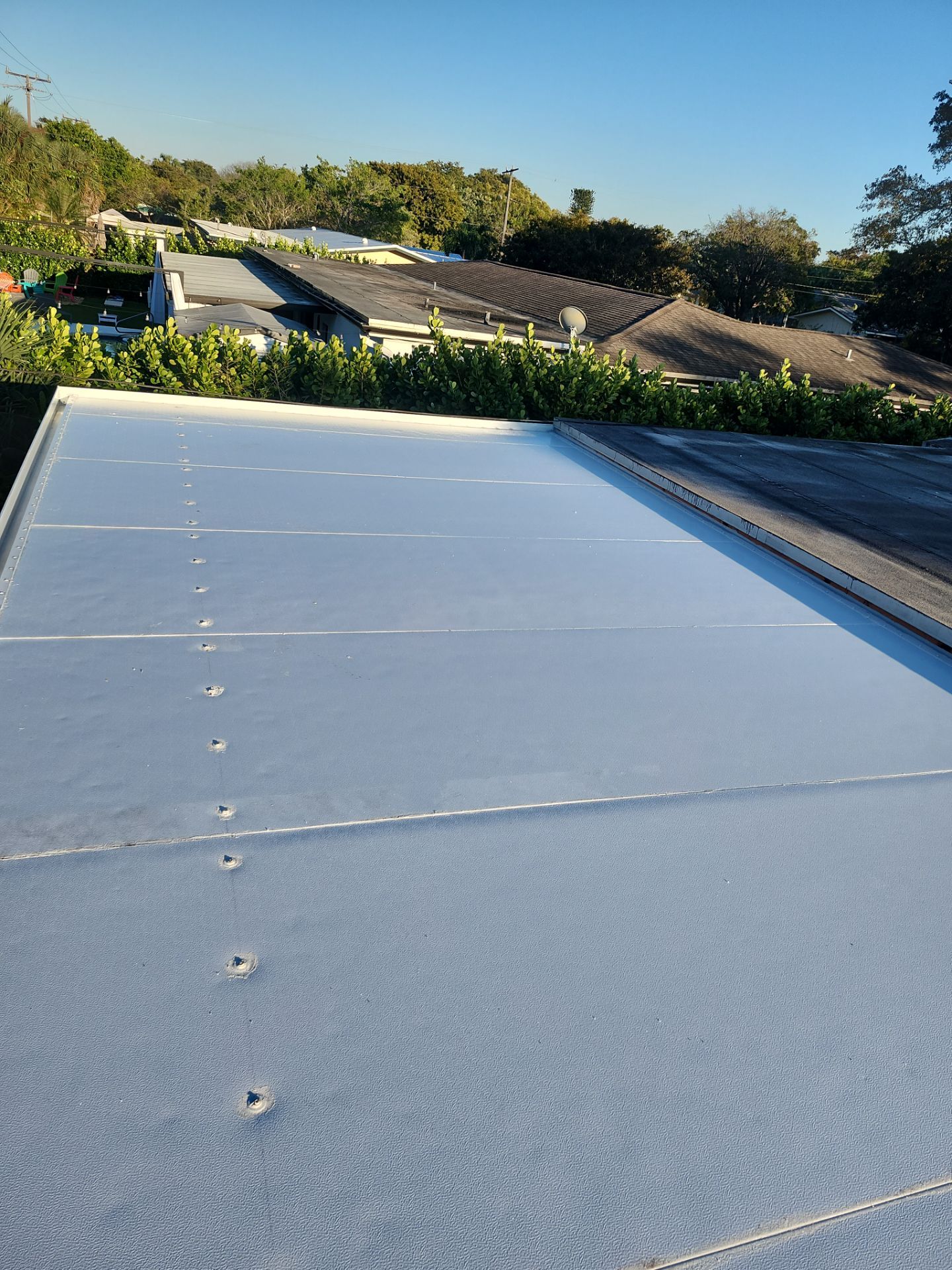 Insulated Screen Enclosure and Wood Tile Deck Installation in Plantation by Aastro Roofing