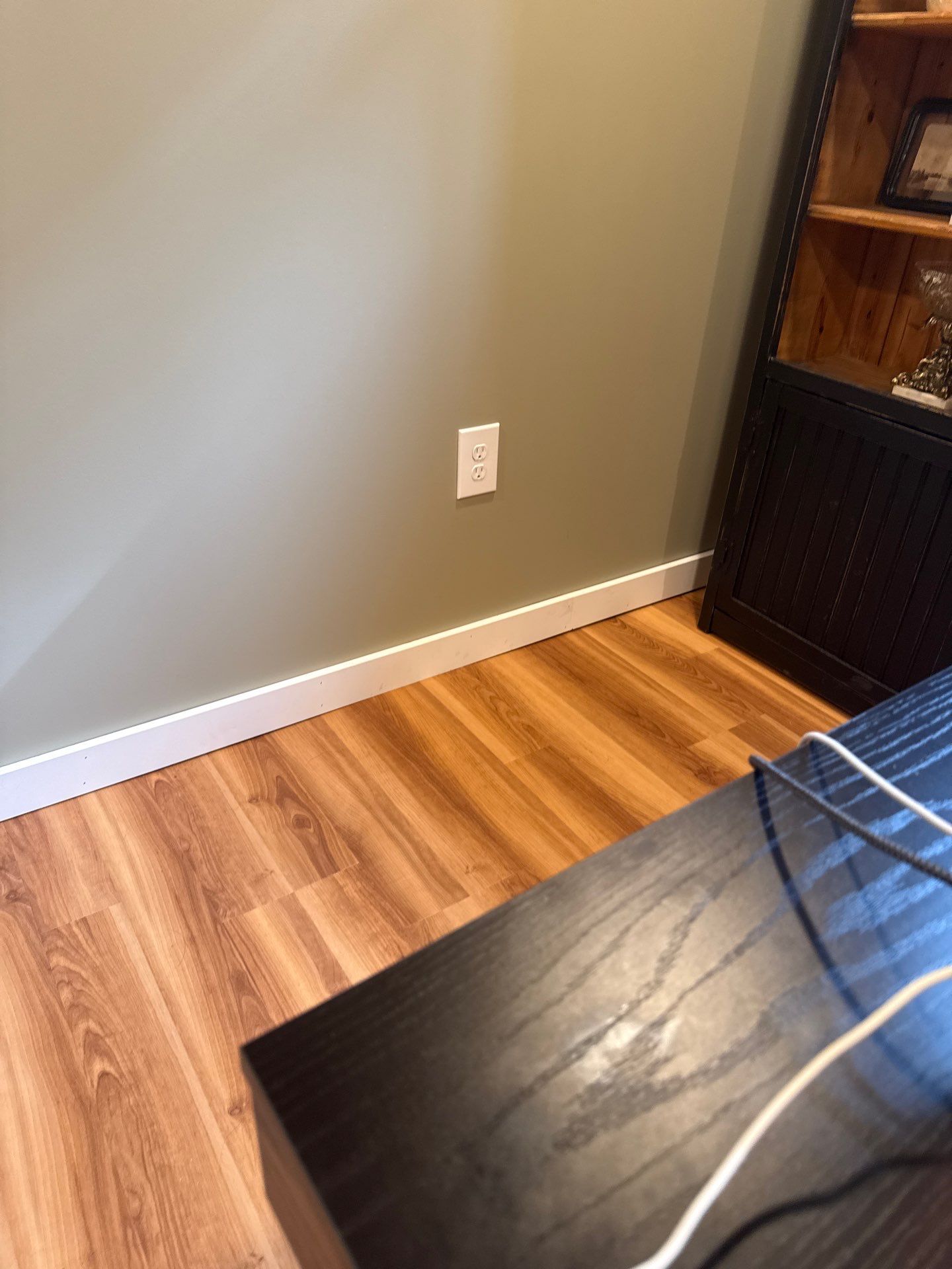 Lincoln Basement Office Renovation with Sage Green Walls and Laminate Flooring by CompanyCam Sales Demo