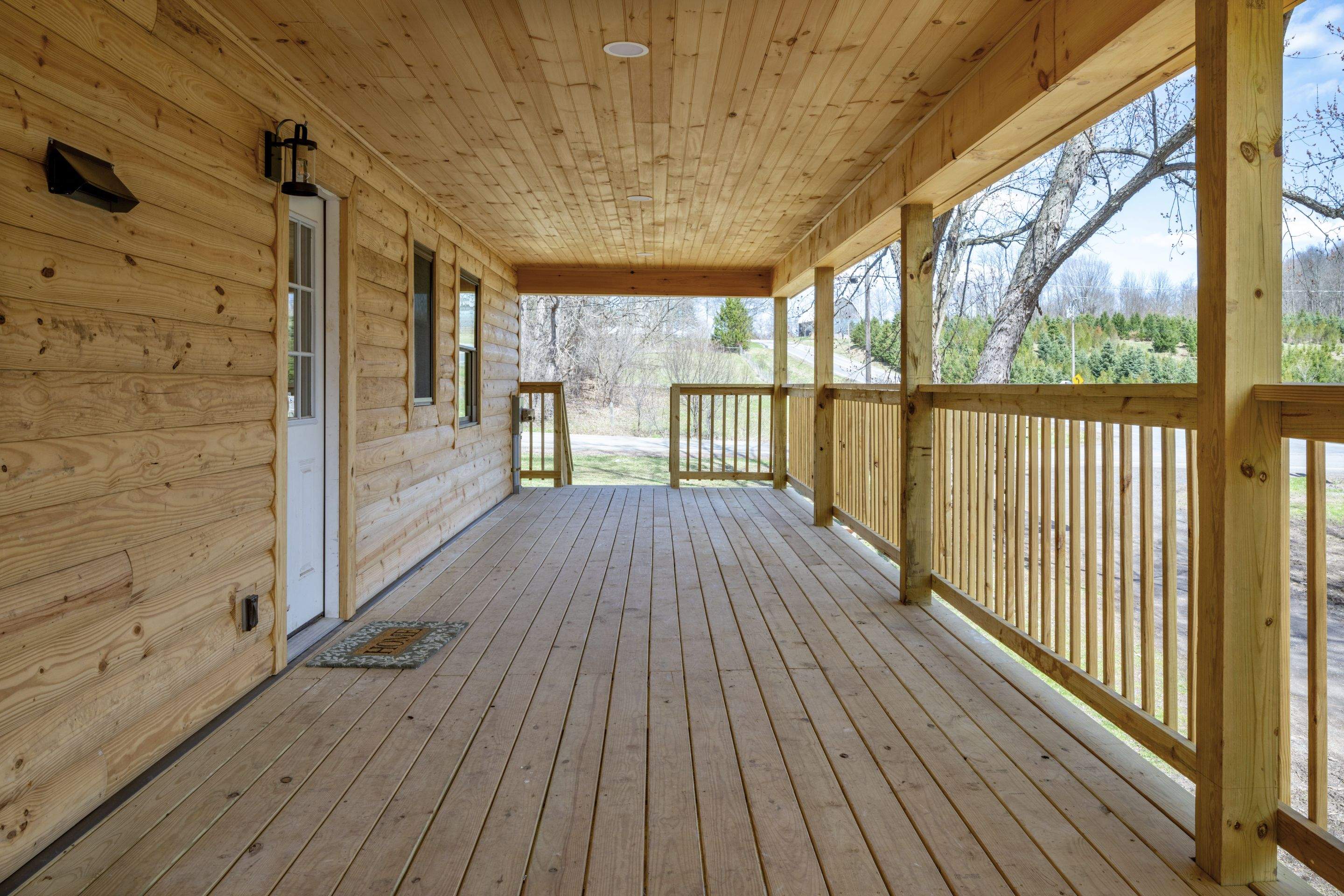 New Addition to Home using Log Cabin Siding  by Horst Custom Homes 