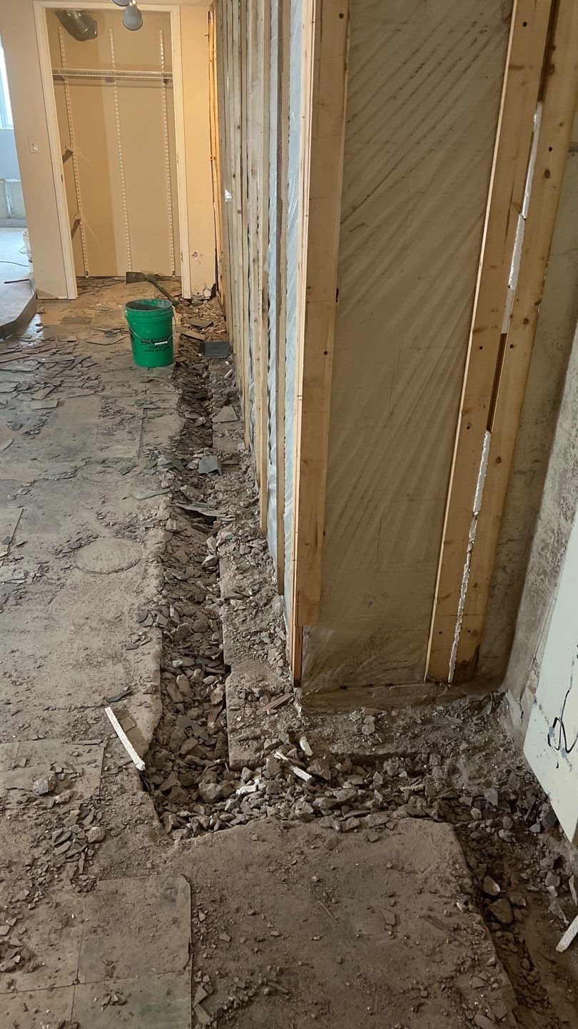 Interior drain tile system installation by ACE Waterproofing & Basement Solutions