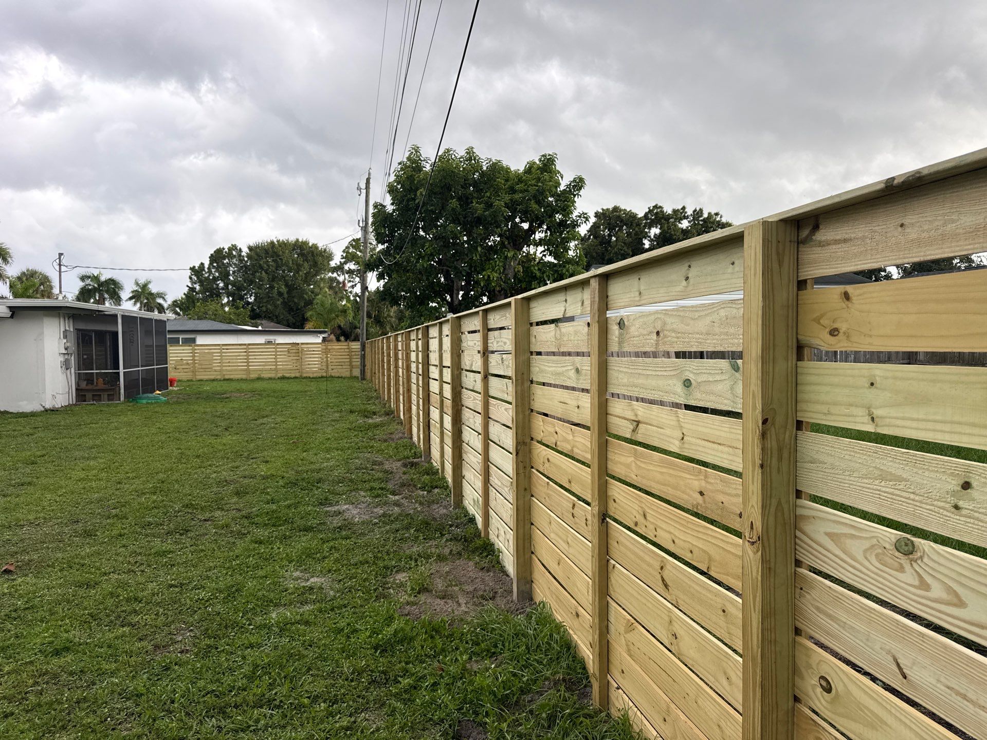 Modern Horizontal Wood Privacy Fence Installation in Fort Myers by True Fence LLC