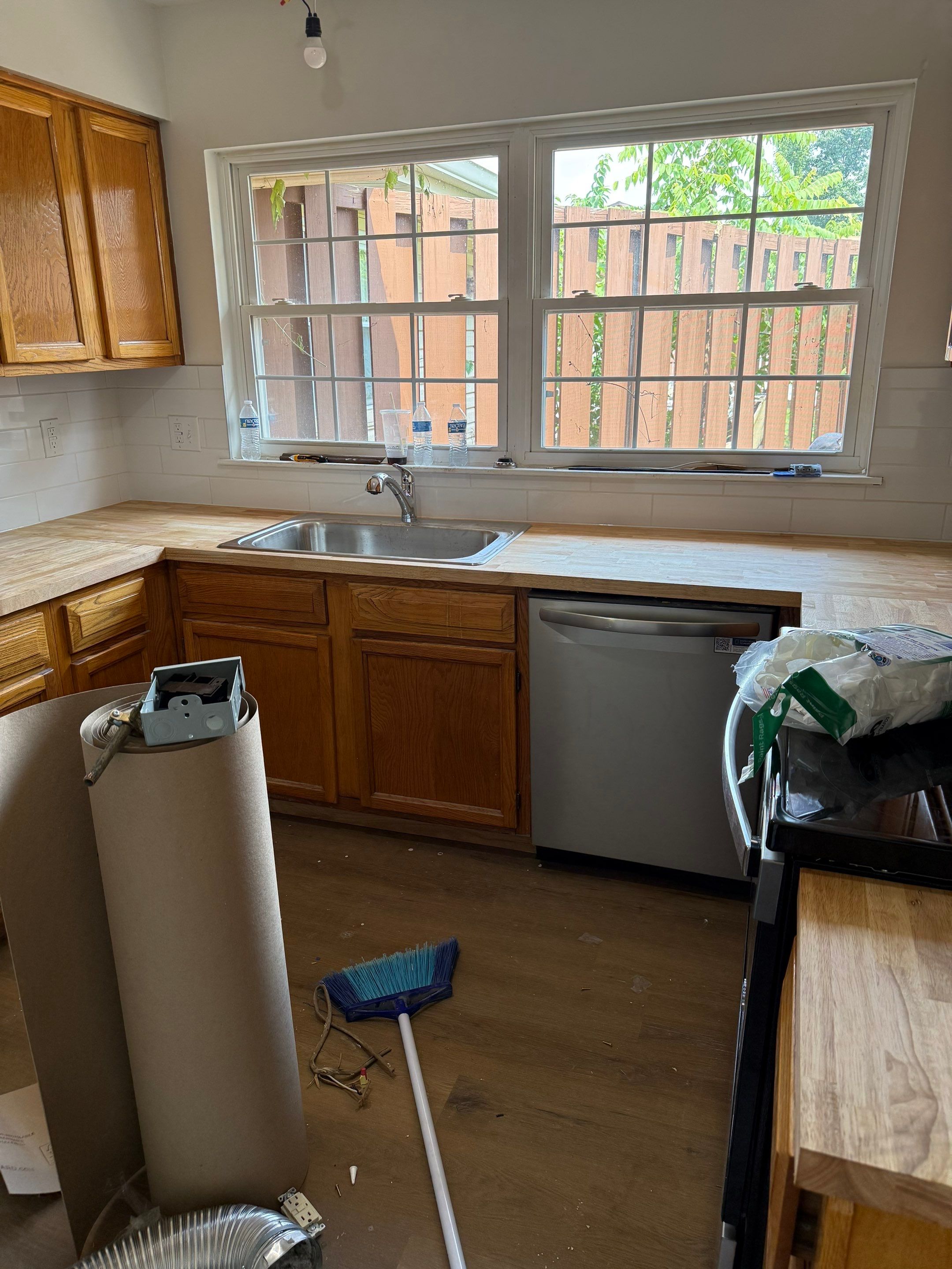 Complete Home Remodel Featuring Custom Kitchen and Wood-Look Plank Flooring by MAJO