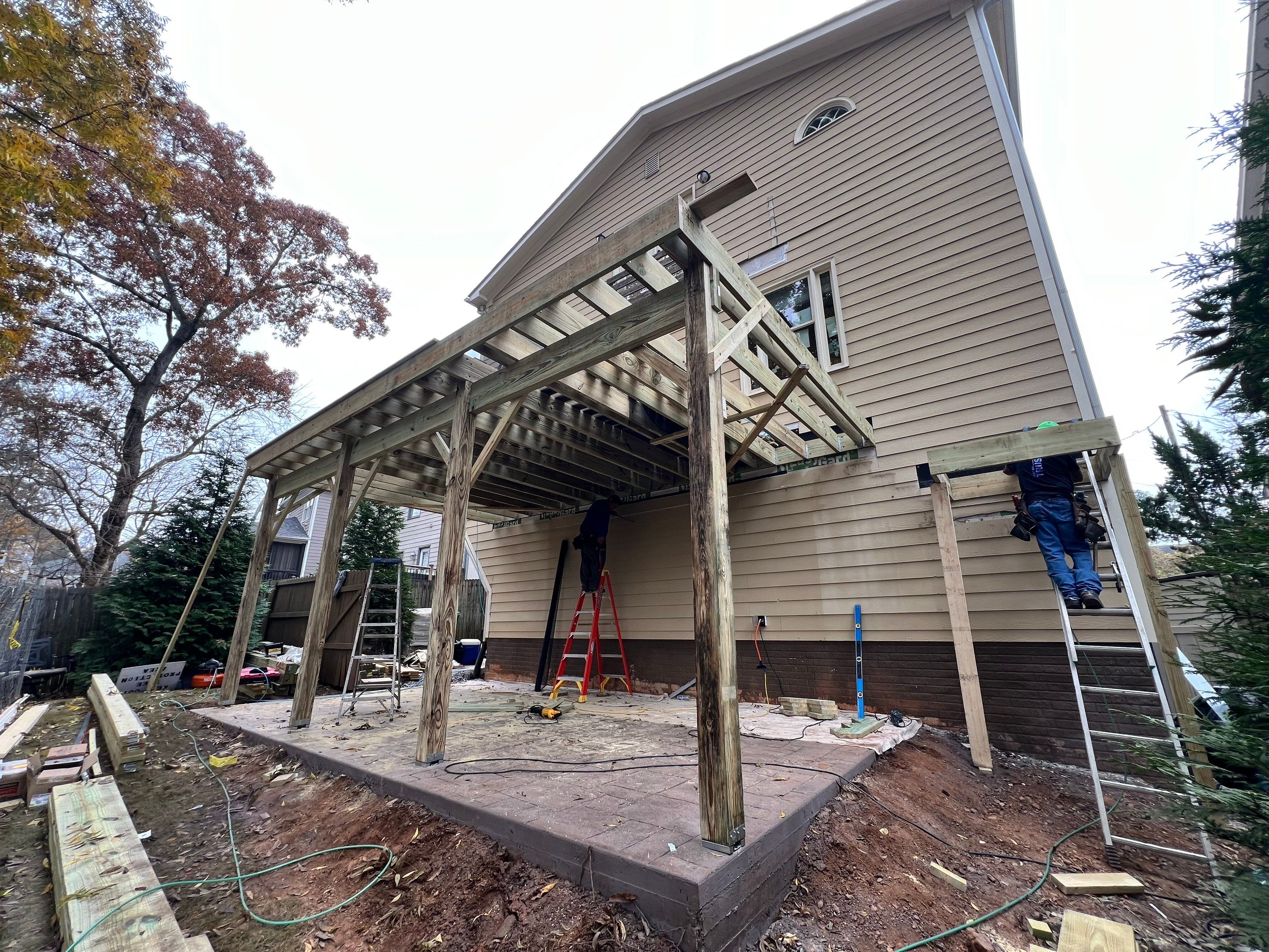 Screened-In Porch With Fireplace by Swift Home Renovations