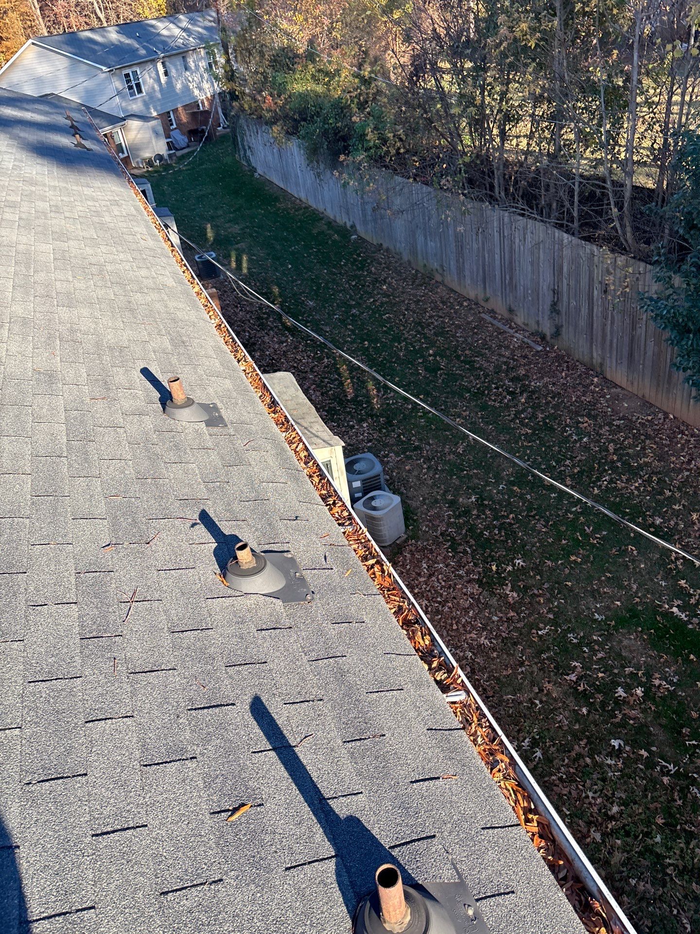 Commercial gutter cleaning Indian Trail & Matthews, NC before photo with filled gutters