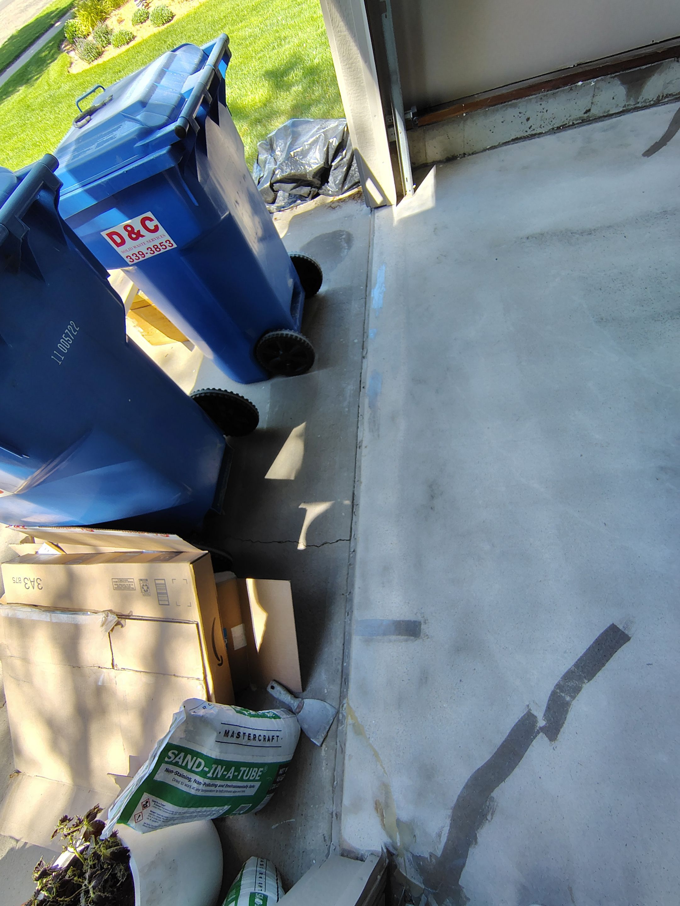 Sioux Falls Garage Concrete Repair and Epoxy Flake Floor Coating by Select Painting, Coatings & Garage Cabinets
