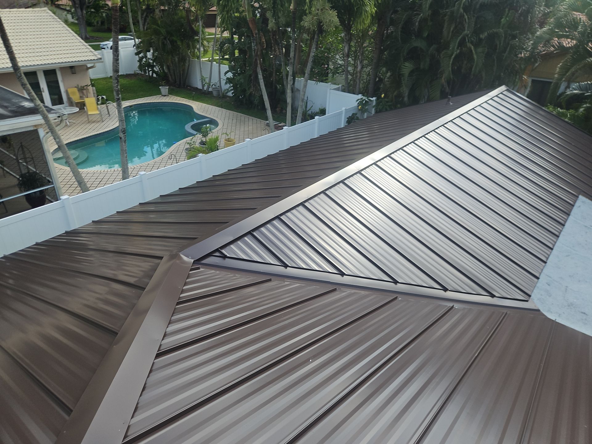 Residential Roofing Installation using 1" Nail strip metal roof by BLUES BROTHERS CONSTRUCTION CORP