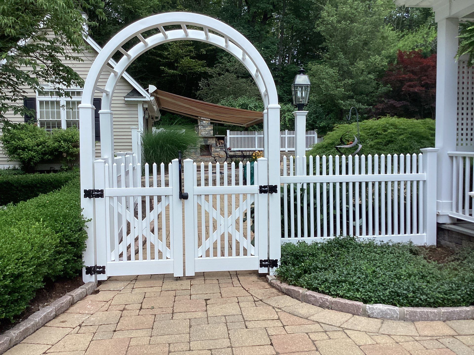 Replacement White Vinyl picket fence and matching gates by DiGiorgi Roofing and Siding Inc