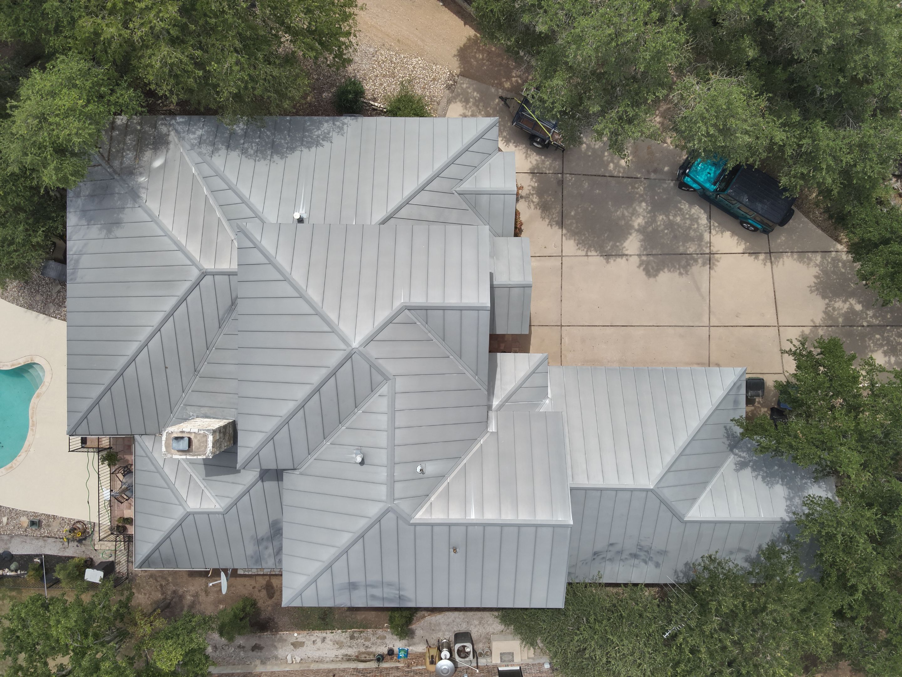 Residential Roof Replacement using 24 GA Double-Lock - Surrey Beige by Action Exteriors Austin