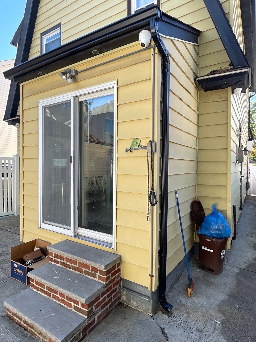 Full House Installation 5" black seamless gutters and 2x3 leaders using 5" black K style seamless gutters and 2x3 black leaders by Above All Gutters