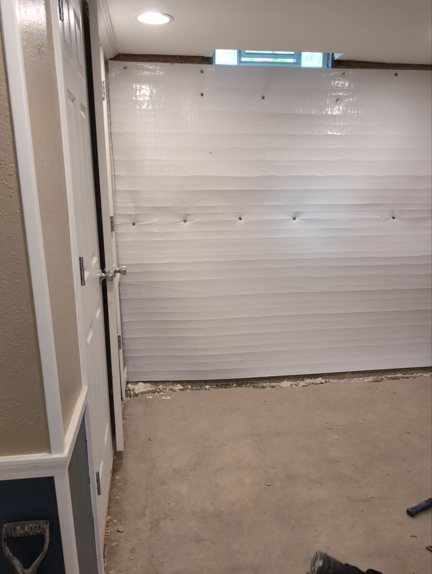 Interior Basement Waterproofing System and Egress Window Installation by Toledo Basement Repair 