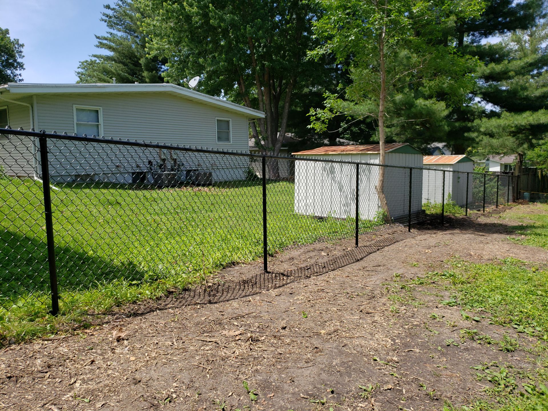 Black Chain Link Fence Installation in Cedar Falls by Perfect Picket Fence and Stain
