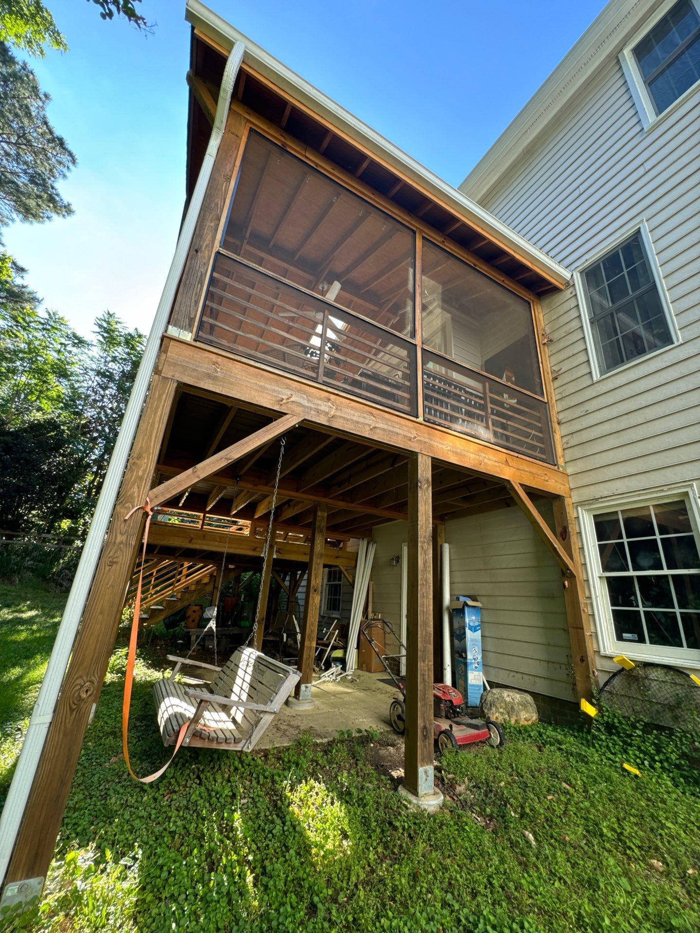 Porch staining by GonzalezPainters & Contractors Inc 