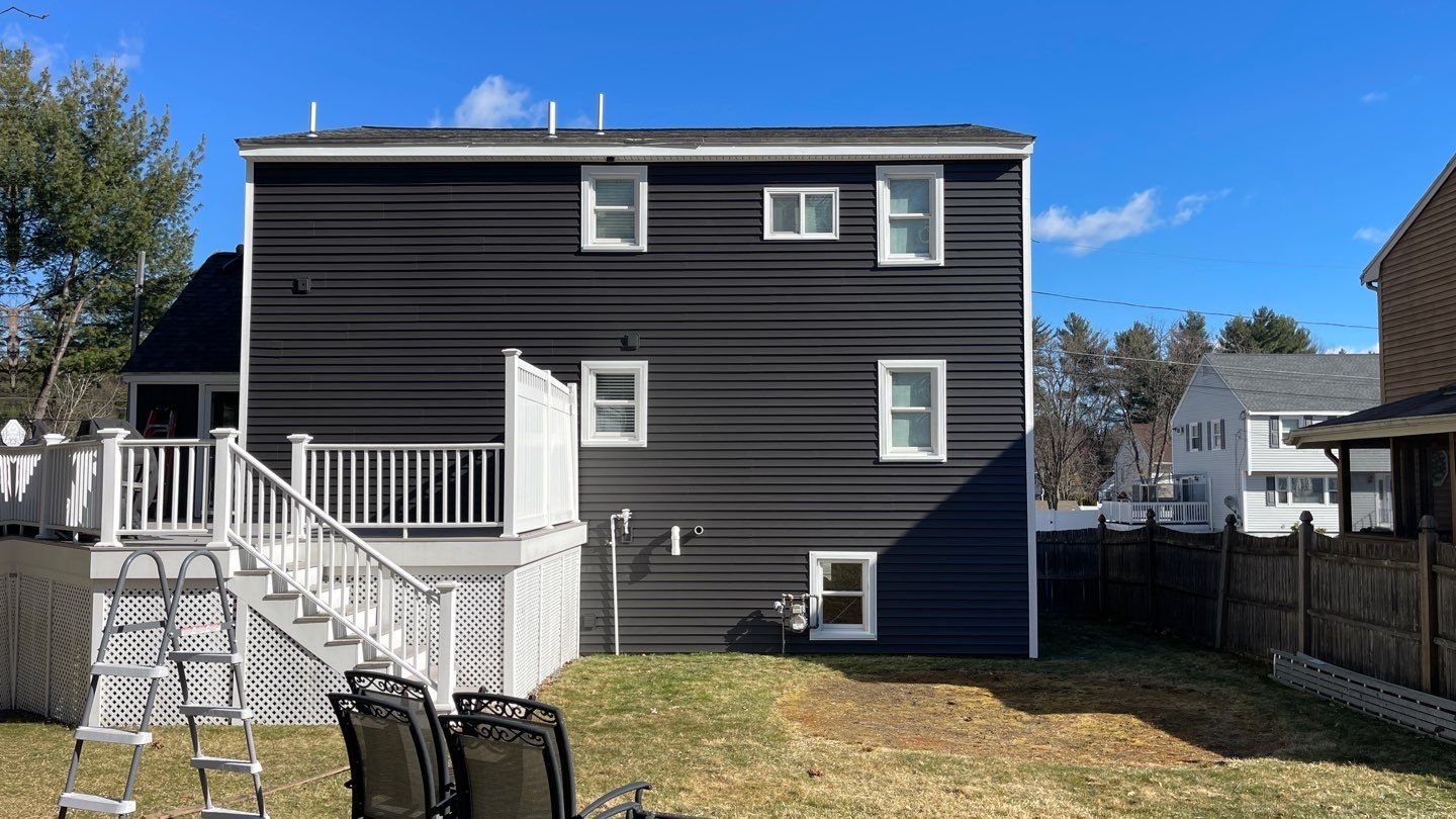 Complete Exterior Renovation with New Siding & Gutters   by Sensible Home Solutions