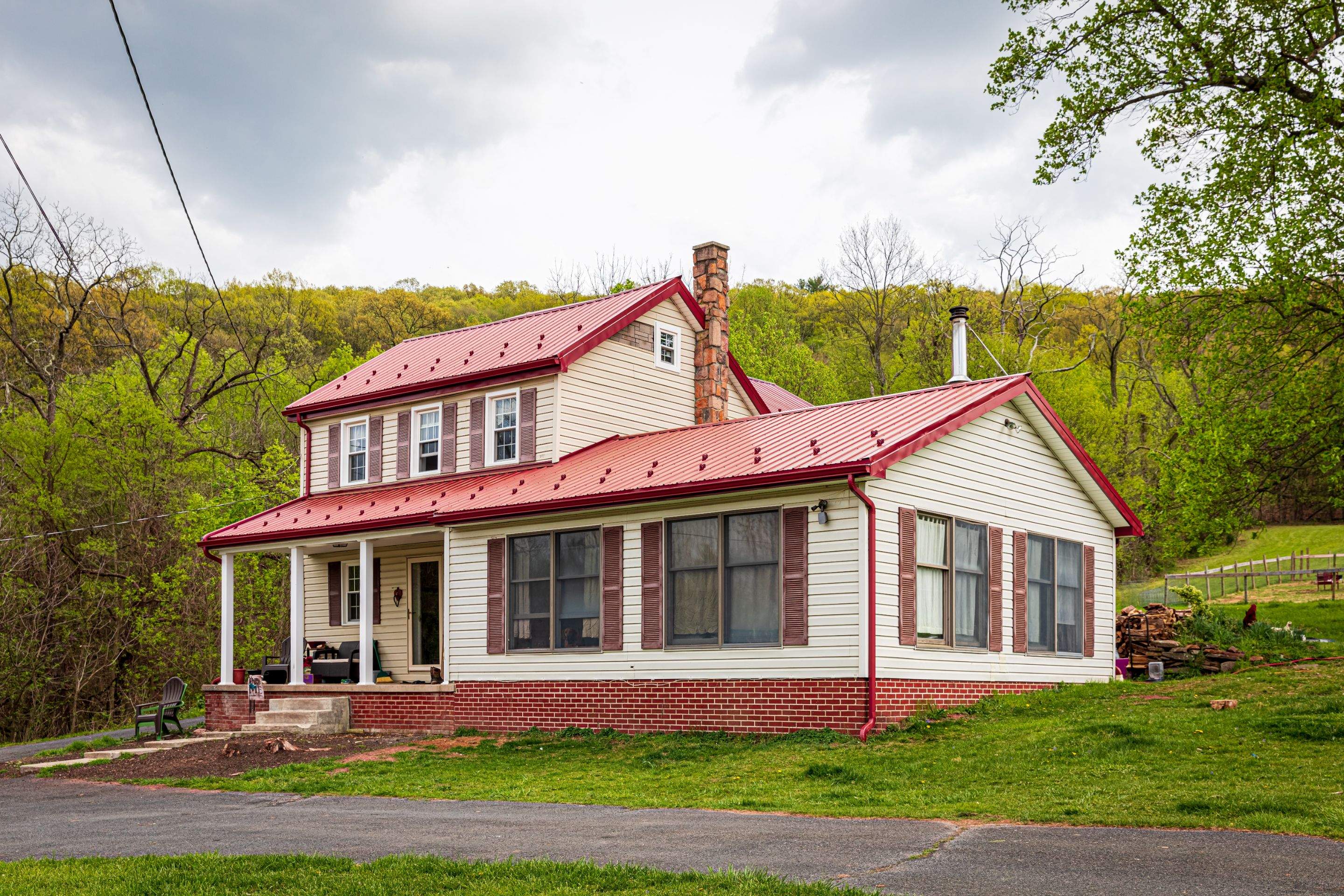 Metal Roof-coloniel red- and new siding by Esh Builders