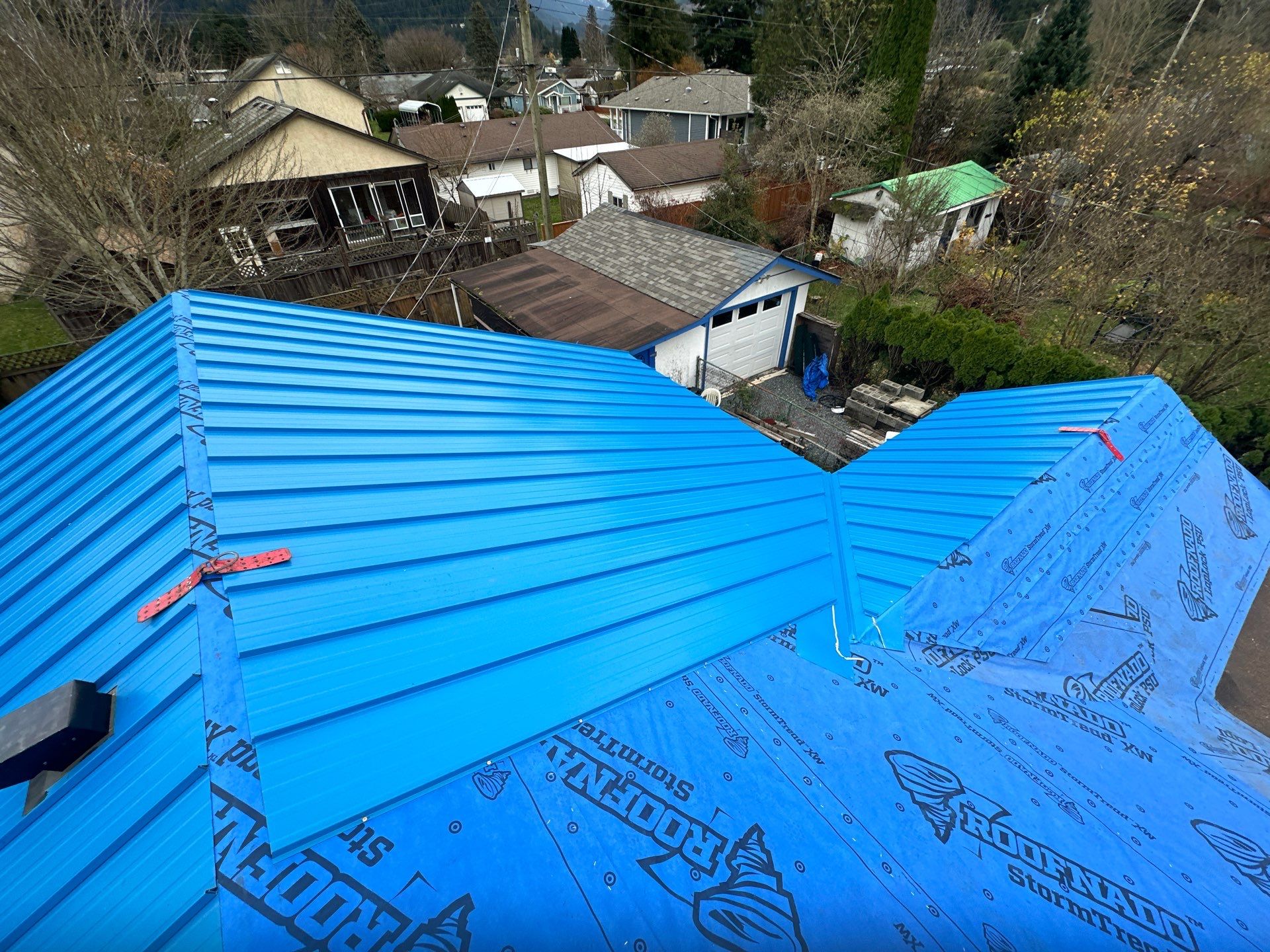 Residential Re-Roof using 12" Prolok metal  by Top Notch Roofing Inc