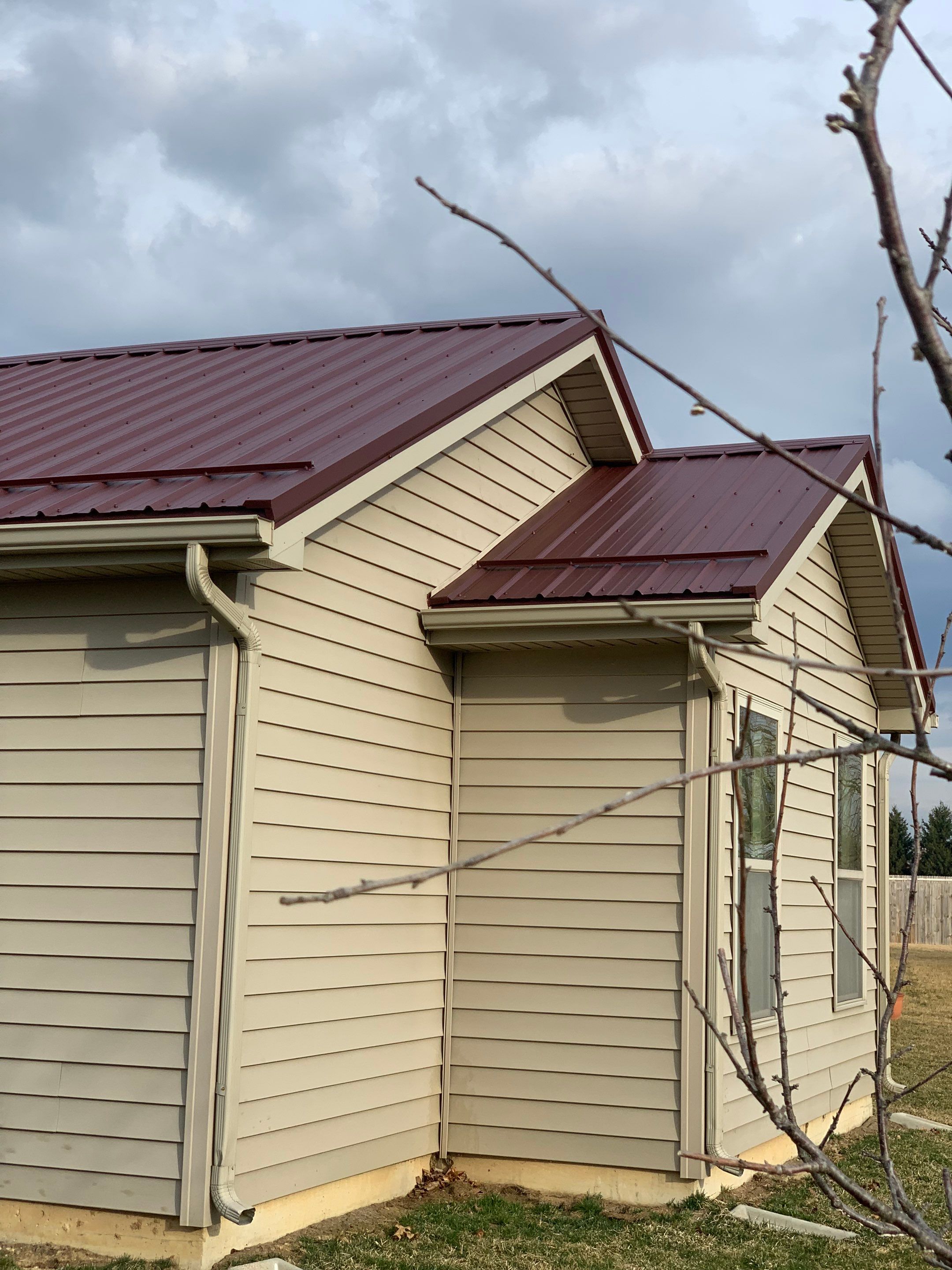 Burgundy Exposed Fastener Metal Roof in Columbia City, Indiana Country Home by 4Ever Metal Roofing