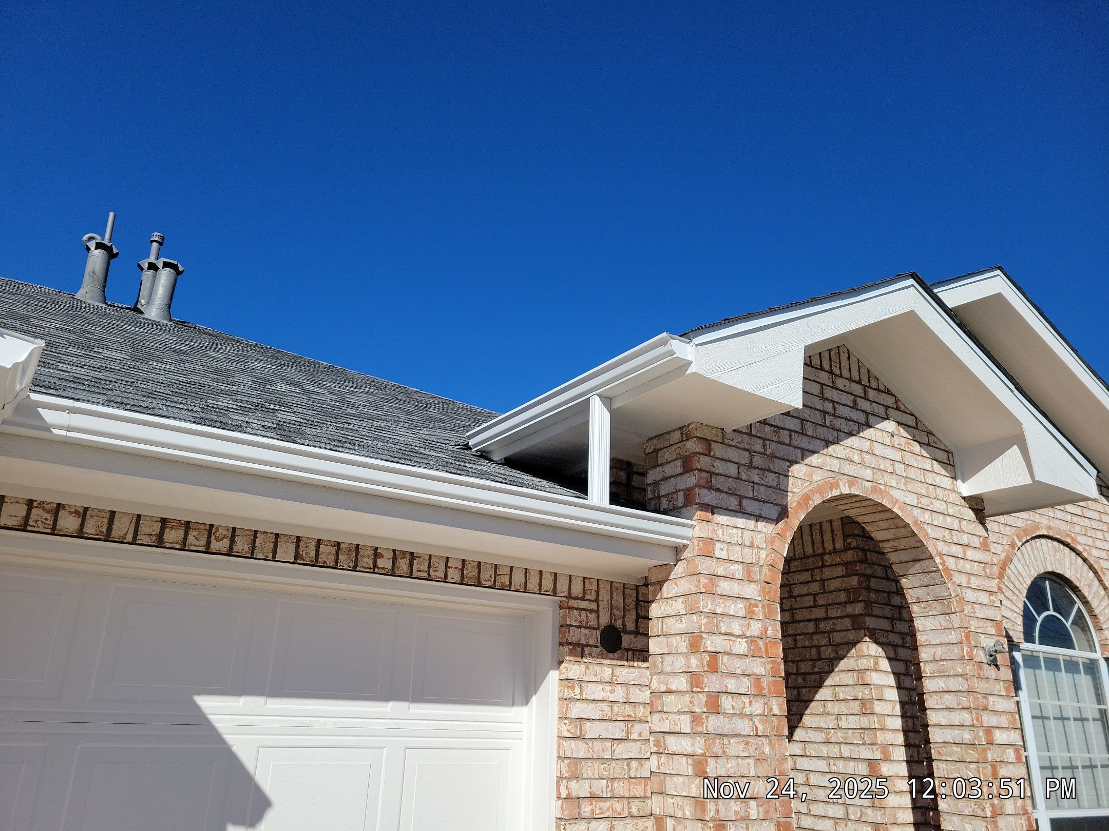 Seamless White Gutter and Downspout Installation in Albuquerque by Doyle Roof Masters Inc