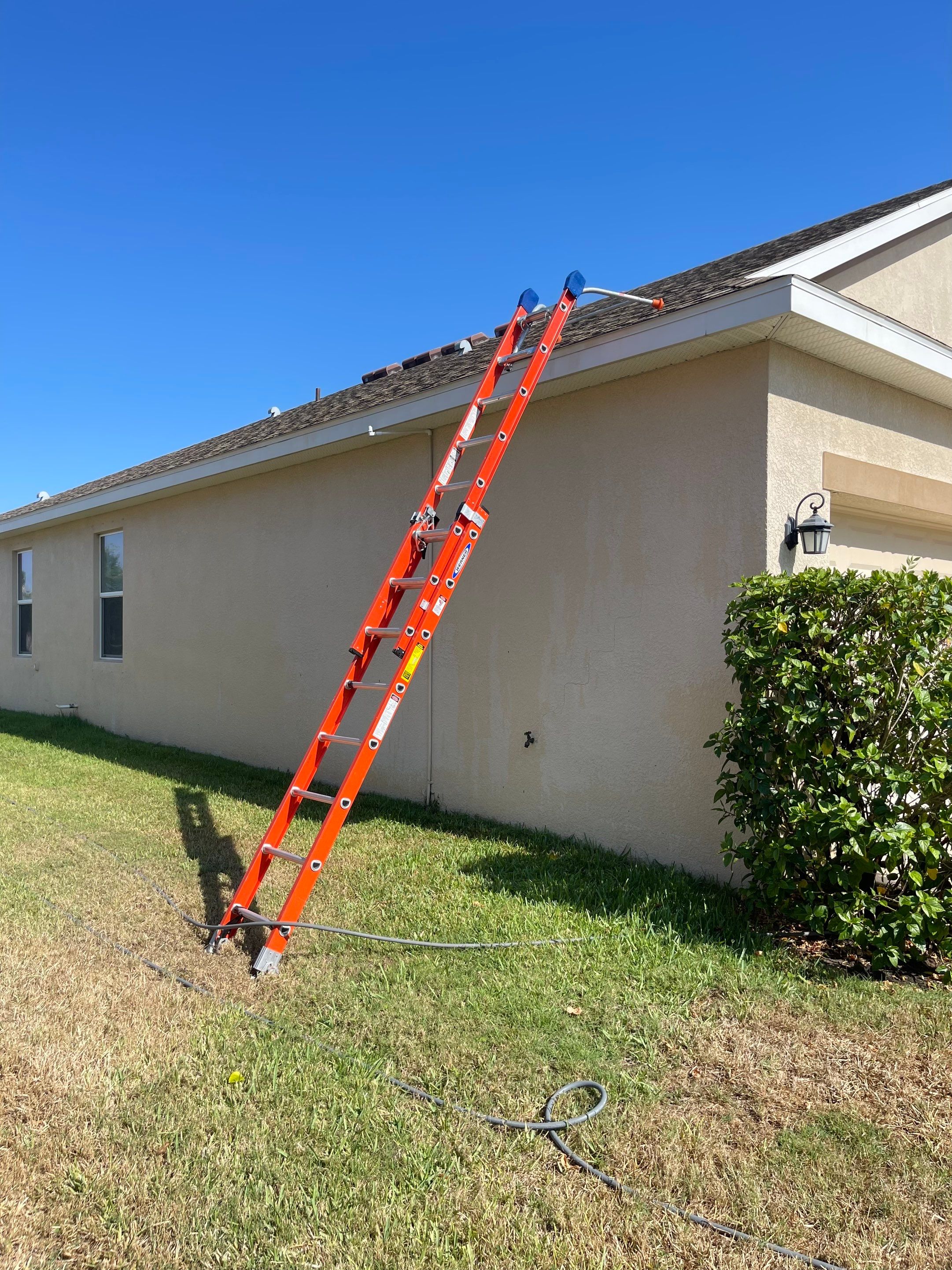 Asphalt Shingle Roof Soft Wash Cleaning & Concrete Pressure Washing in CopperStone Community, Parrish, FL by Sunshine AquaWash
