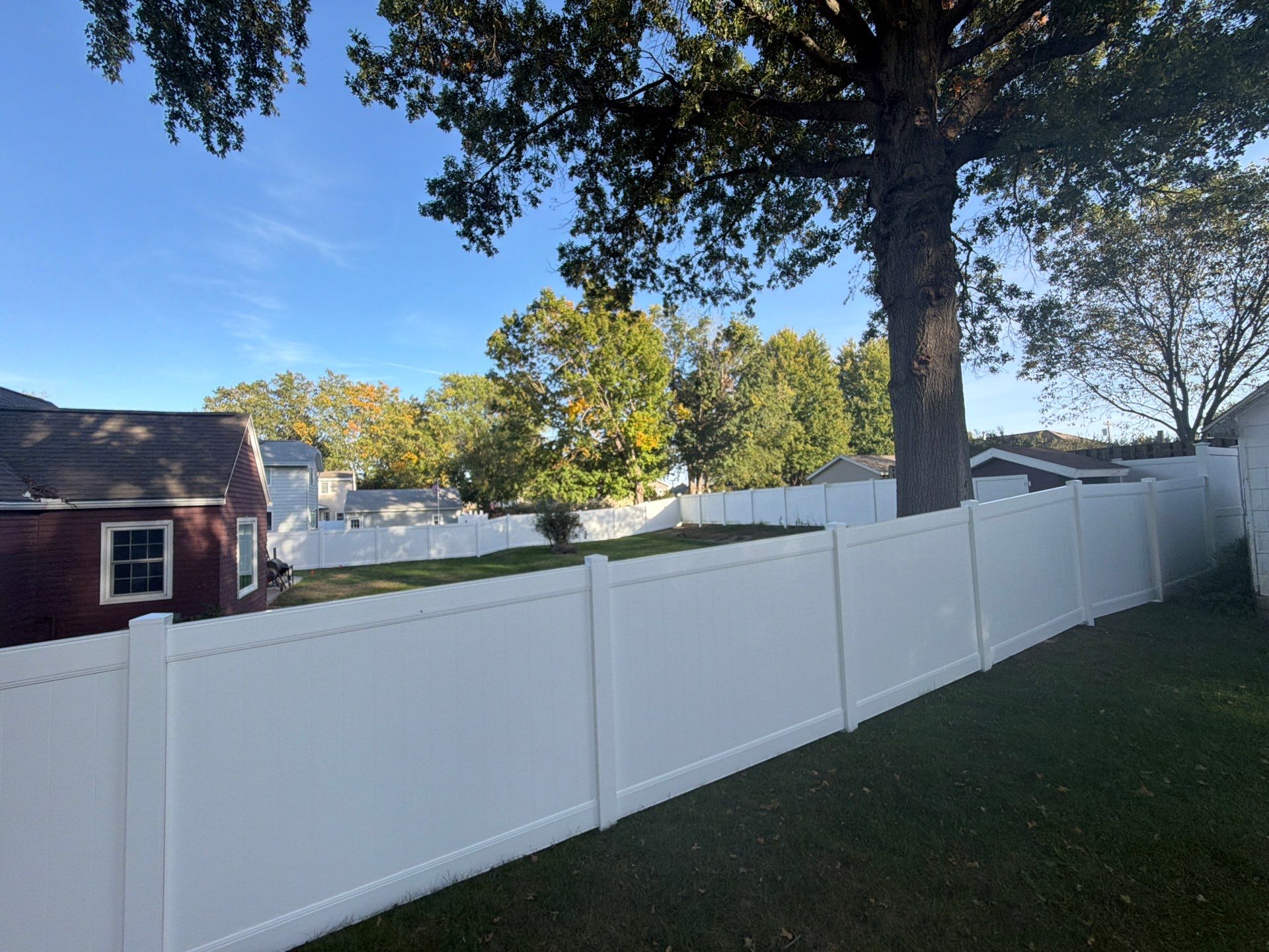 White Vinyl Privacy Fence and Gate Installation in Grundy Center by Perfect Picket Fence and Stain