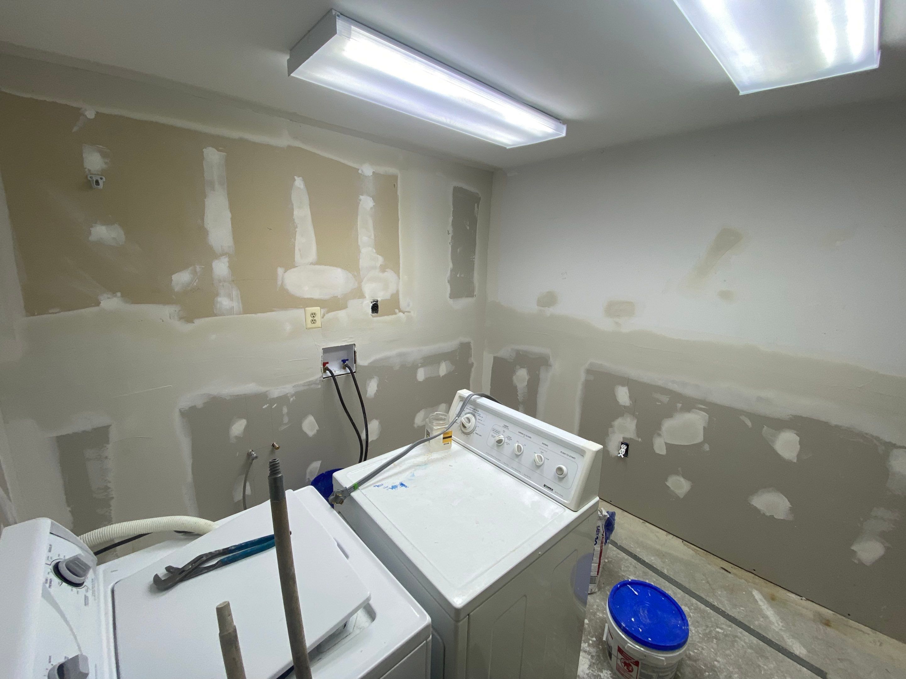 Laundry Room Redmodel using Lifeproof Luxury Vinyl Plank Flooring by The Smet Companies, LLC