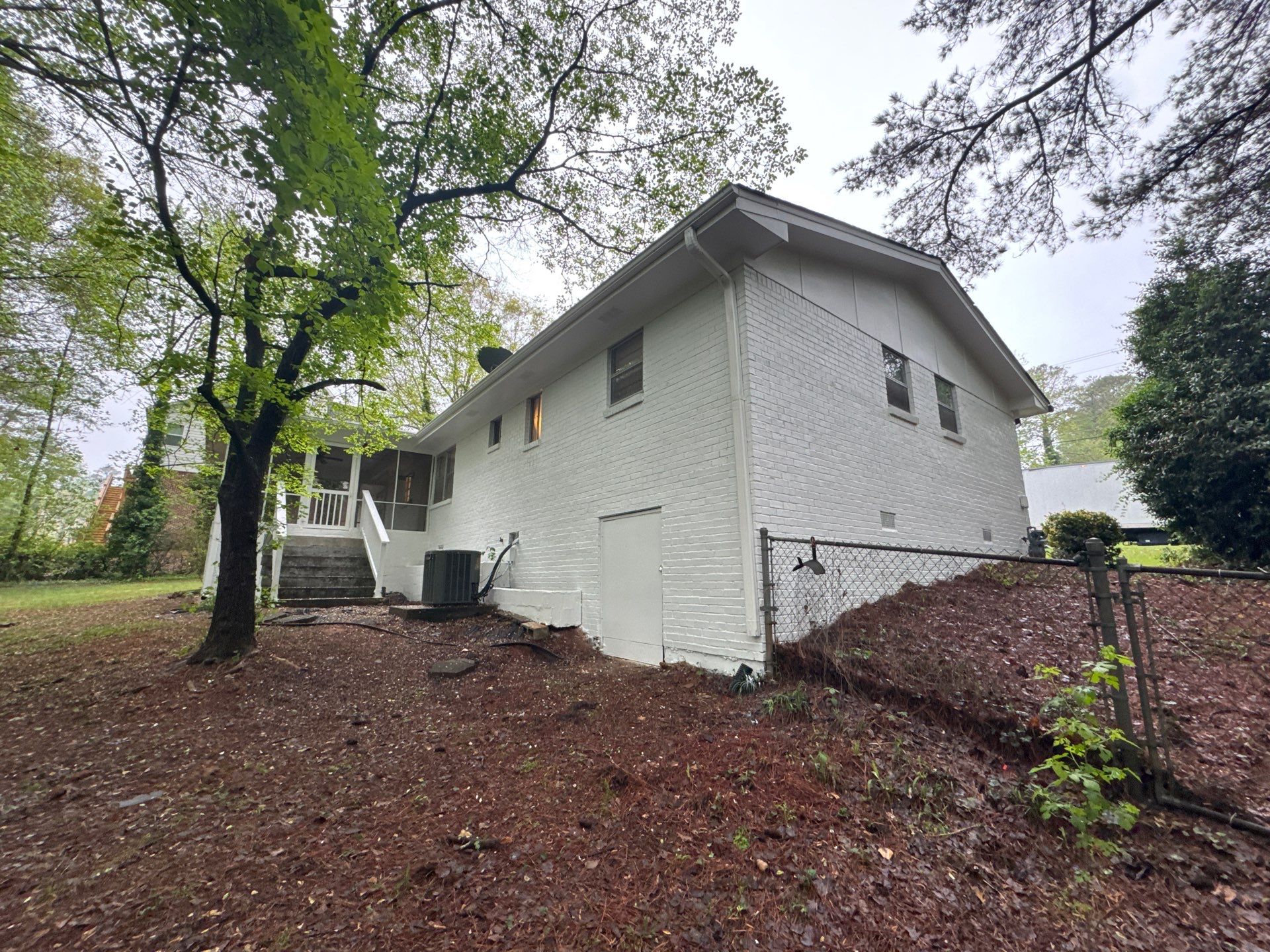 White Brick Exterior Painting and Shutter Refresh in Marietta by Swift Home Renovations