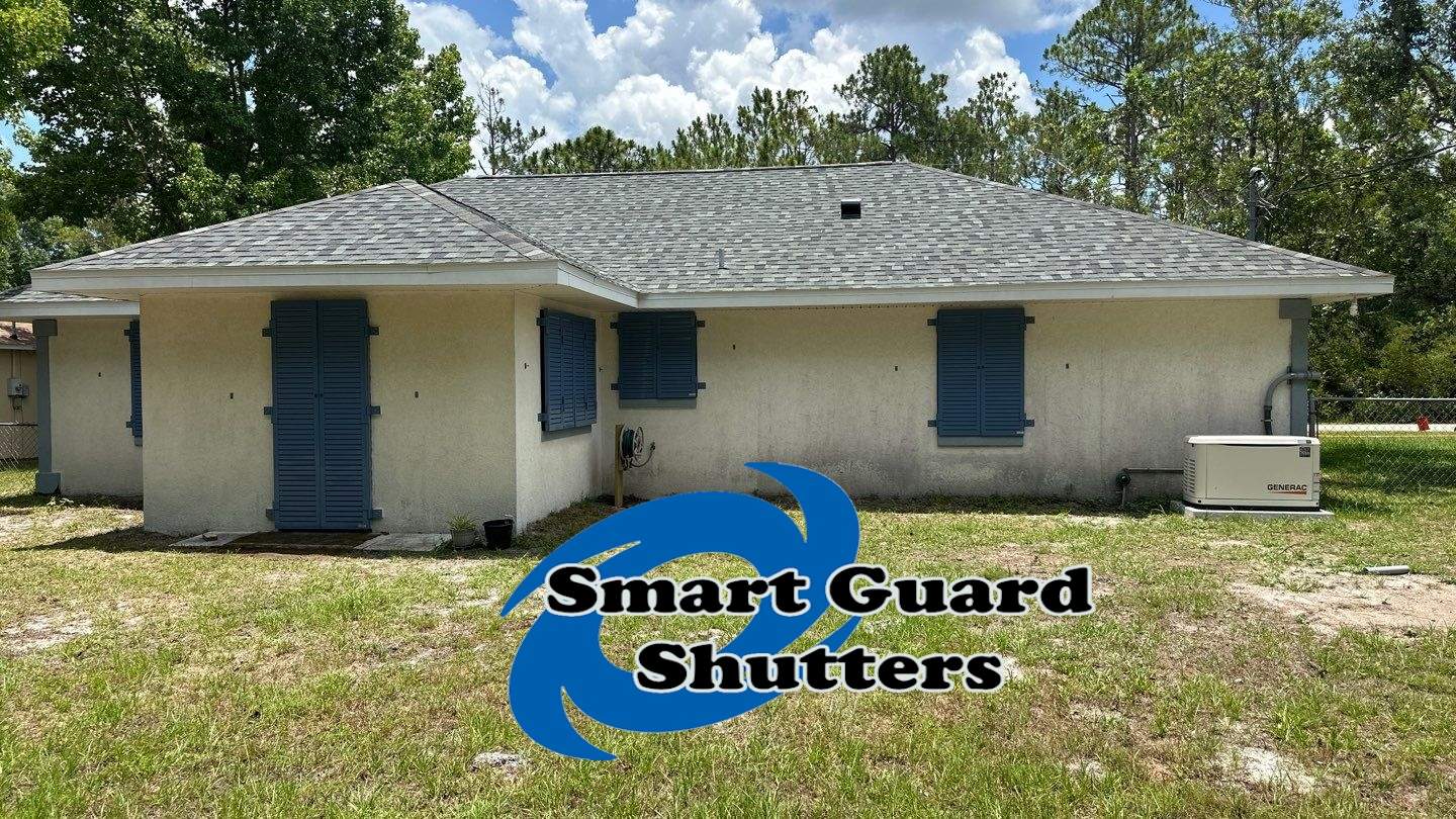 Impact Rated Colonial Shutters in Pigeon Blue by Smart Guard Shutters