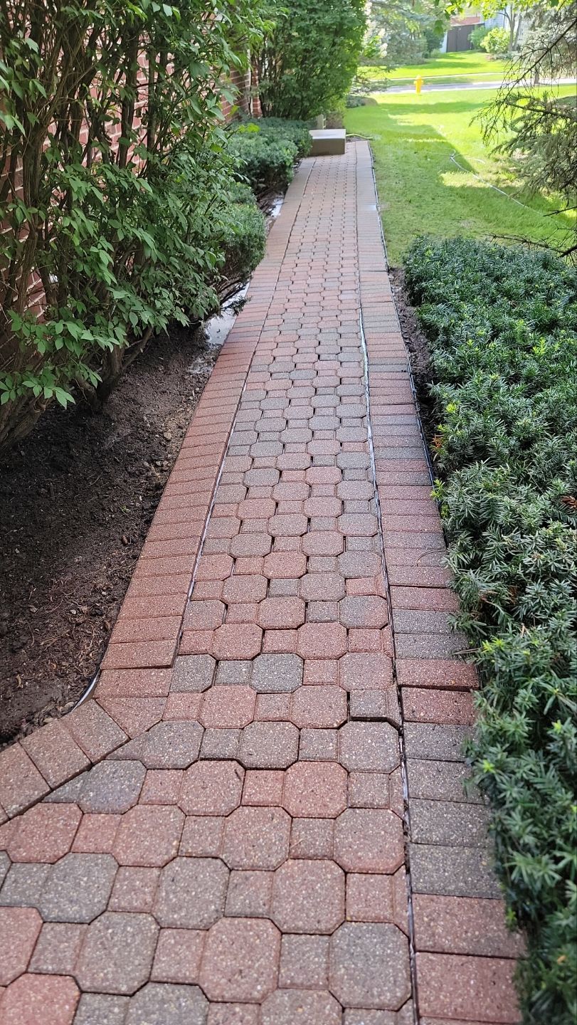 Brick paver repair, clean and seal by Northern Power Washing LLC.