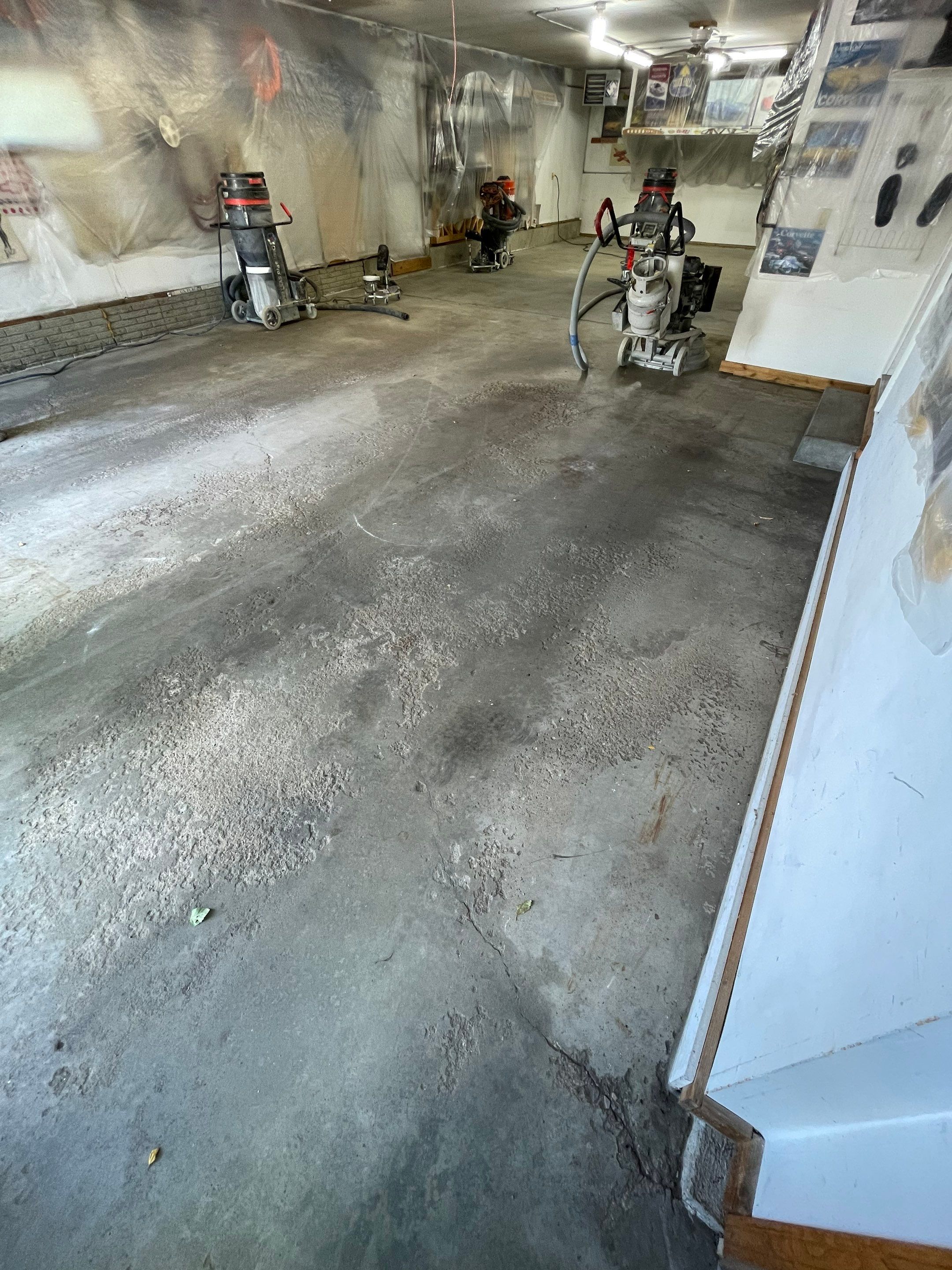 High-Performance Polyurea Garage Floor Coating and Stem Wall Finishing in Sioux Falls by Select Painting, Coatings & Garage Cabinets