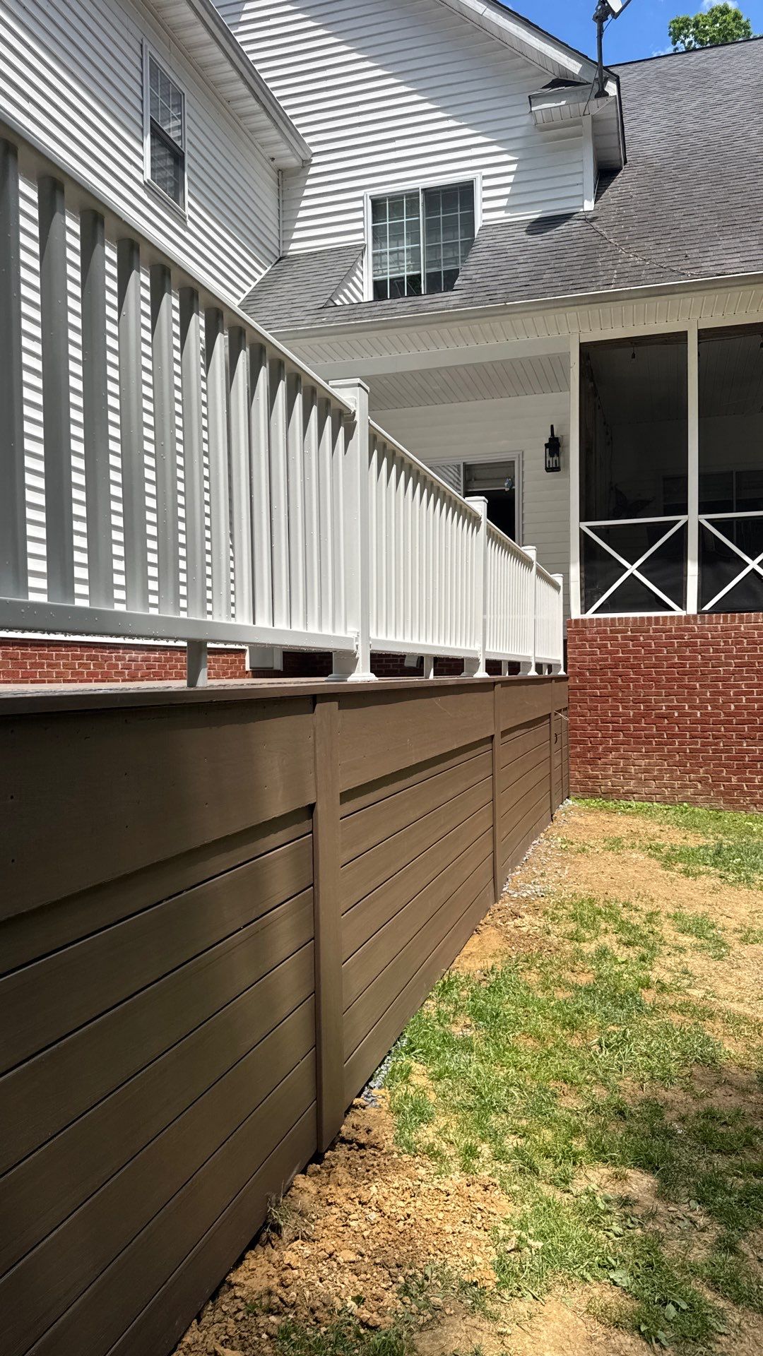 Custom Composite Deck and White Vinyl Railing Installation in Fayetteville by Walnut Hollow Decks & Outdoor Living
