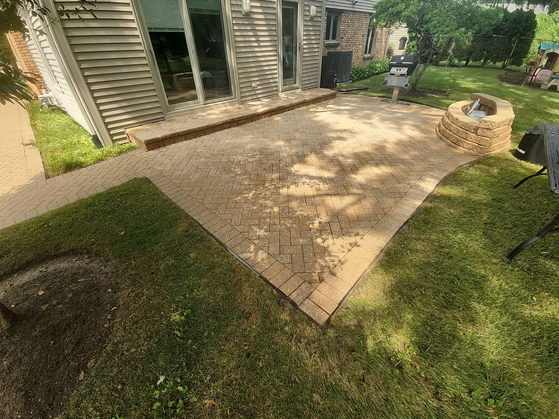 Arlington Heights Brick paver repair, cleaning and sealing by Northern Power Washing LLC.