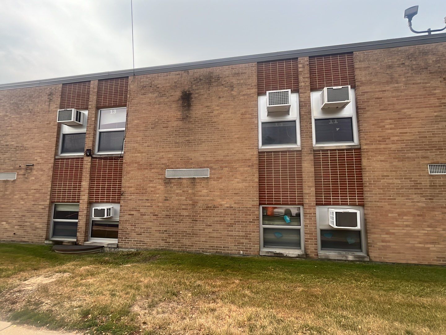 Commercial brick exterior cleaning by Northern Power Washing LLC.