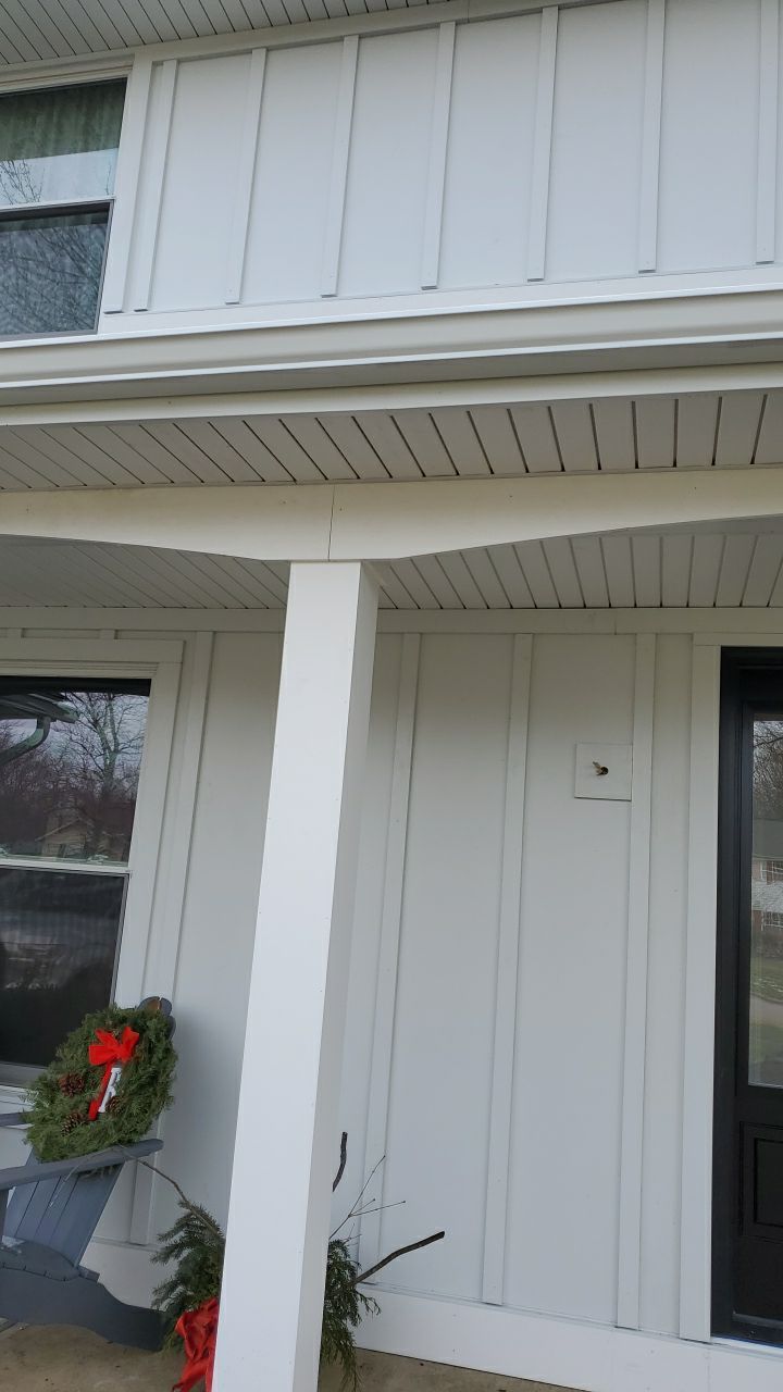 James Hardie Siding  using James Hardie Board and Batten, White by Absolute Roofing and Construction