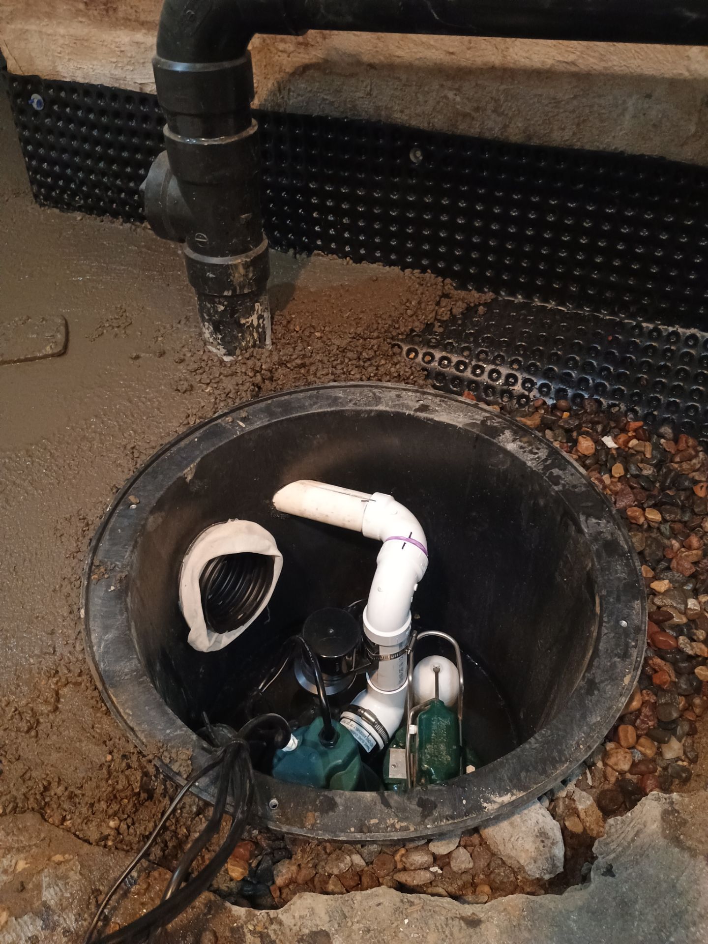 Interior Drain Tile & Sump Pump Installation in St. Paul, MN by Waterproofing Northeast