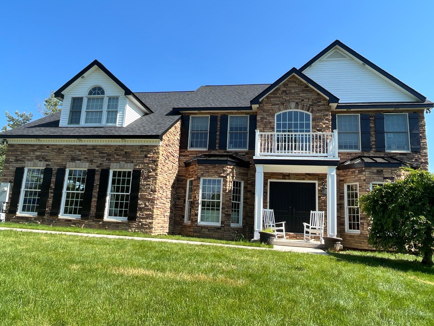 Roof Damage using Certainteed Lifetime Roofing System- Moire Black Landmark Pro shingkes with shadow ridge caps. by BulletpROOF Exteriors
