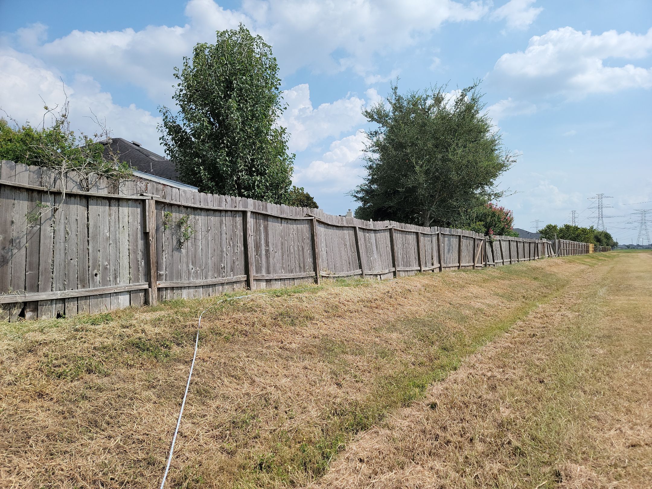 Beautiful Wood fence with metal posts by Tim's Fences